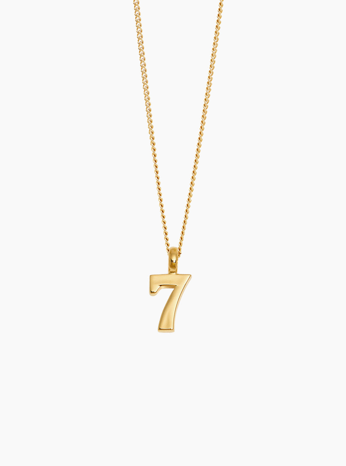 Gold No 7 pendant on fine curb chain, slim gold-tone necklace.