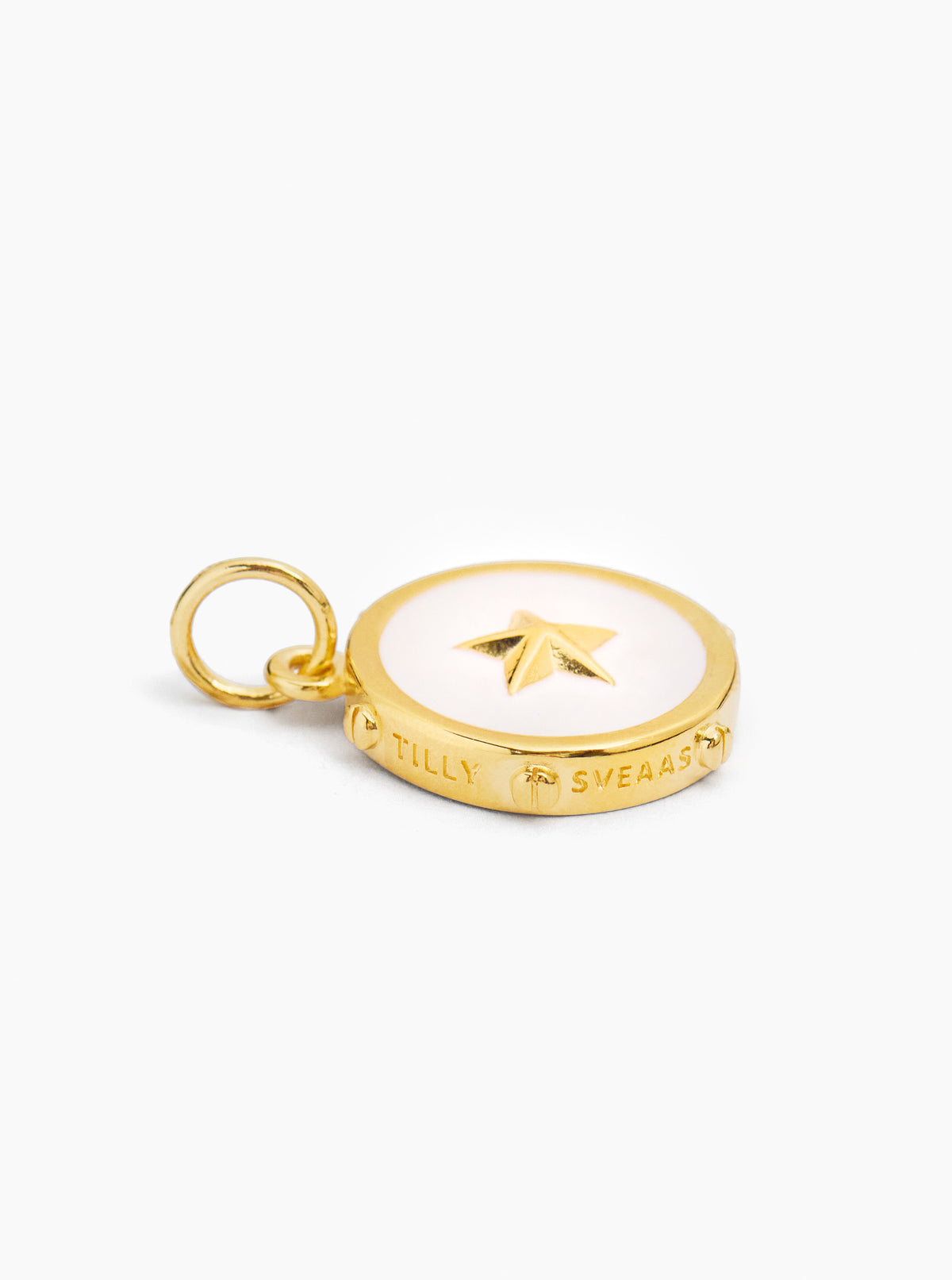 Gold-tone cream enamel disc charm with star motif and small hanging ring