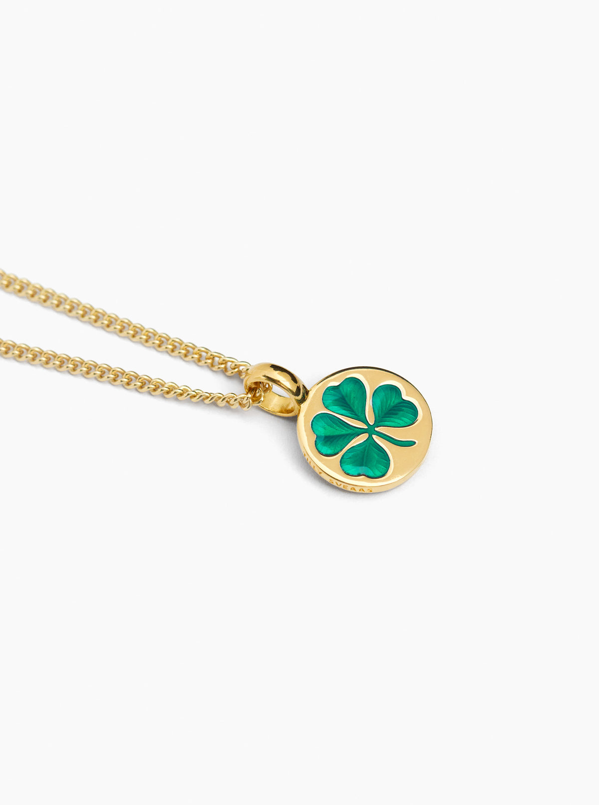 Gold clover pendant necklace with green enamel on fine curb chain