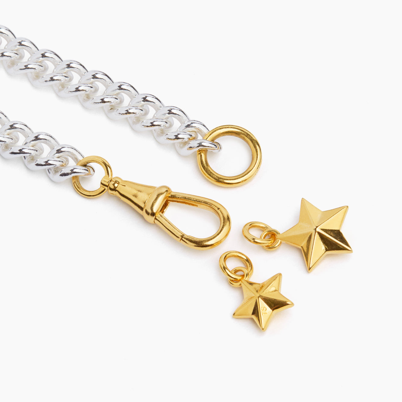 Two-tone chain bracelet with gold star pendants and clasp