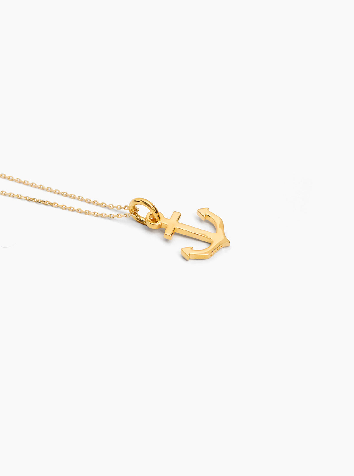Gold anchor charm on trace chain necklace with small lobster clasp