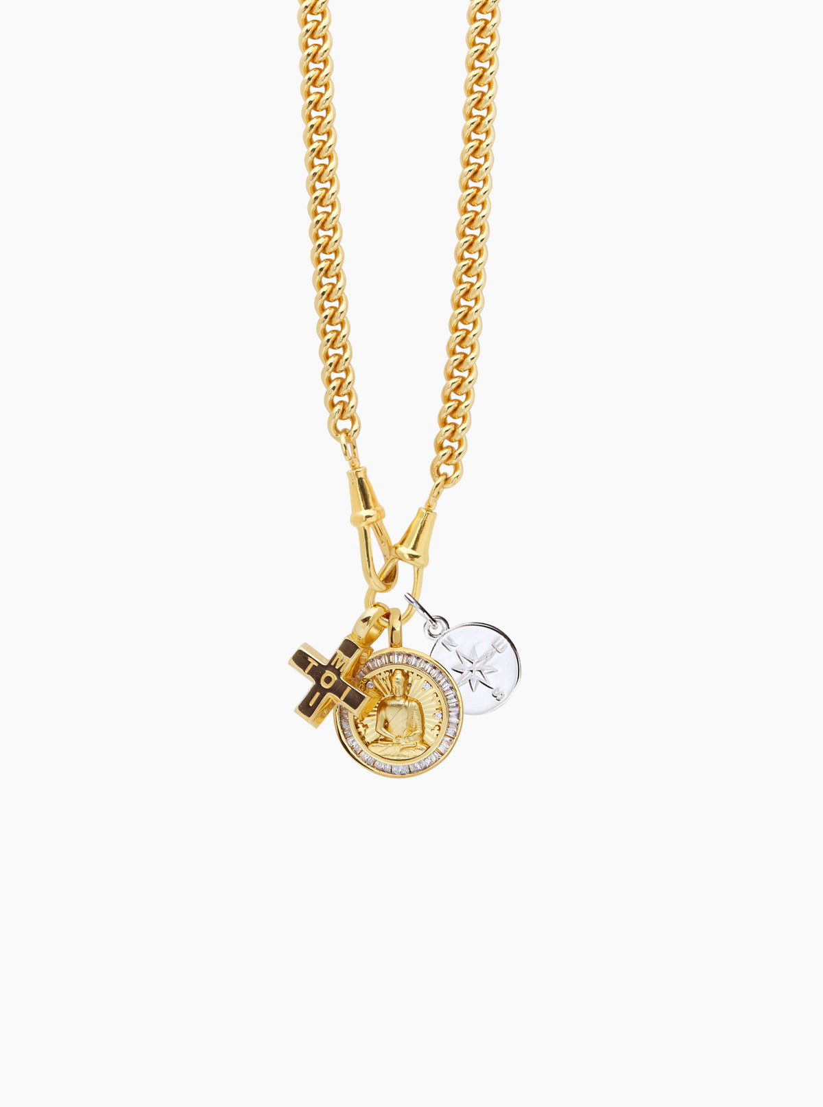 Gold-tone layered chain necklace with circular compass charm and cross pendant