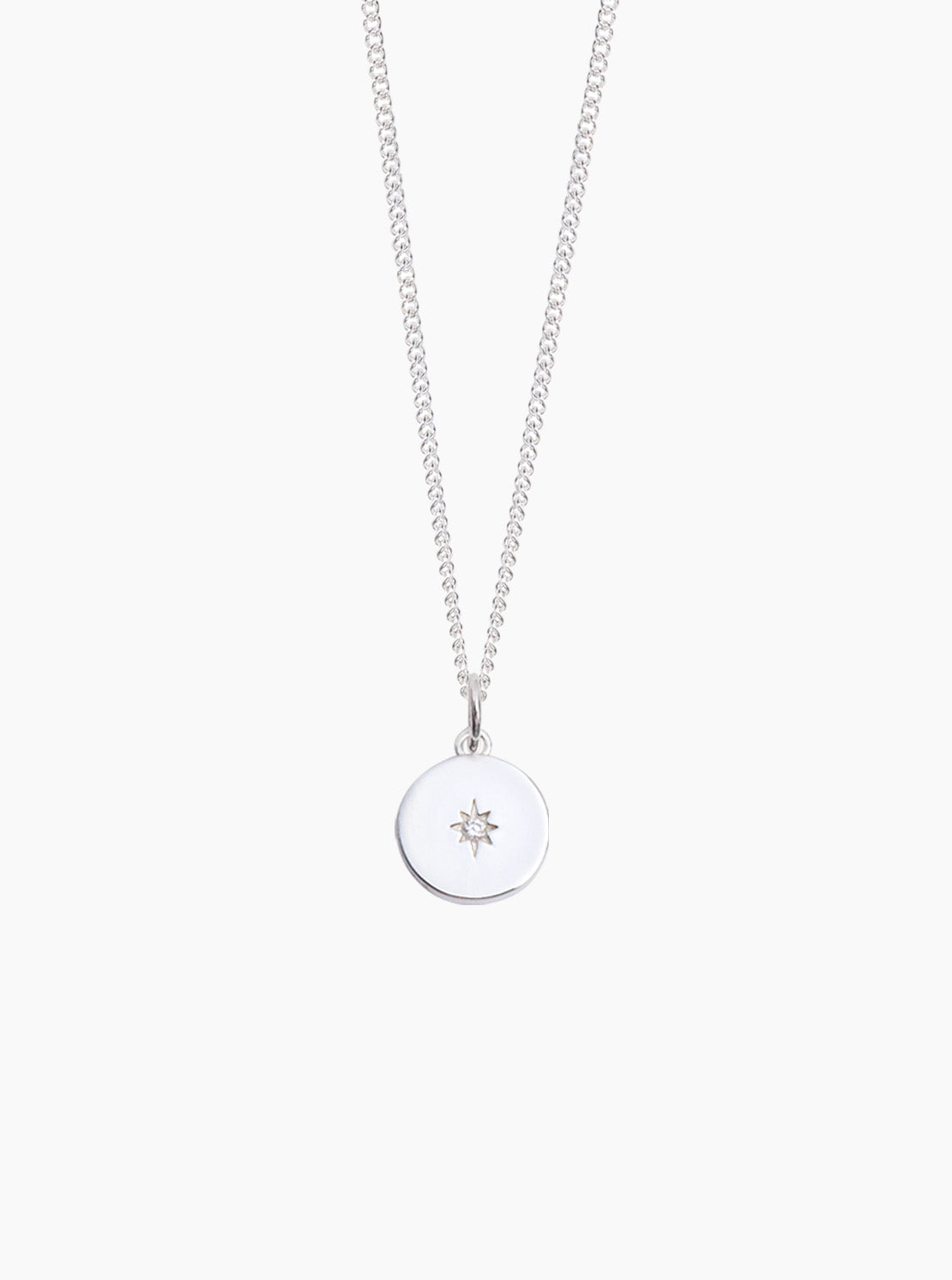 Silver disc pendant necklace with star charm on fine curb chain, pendant centered