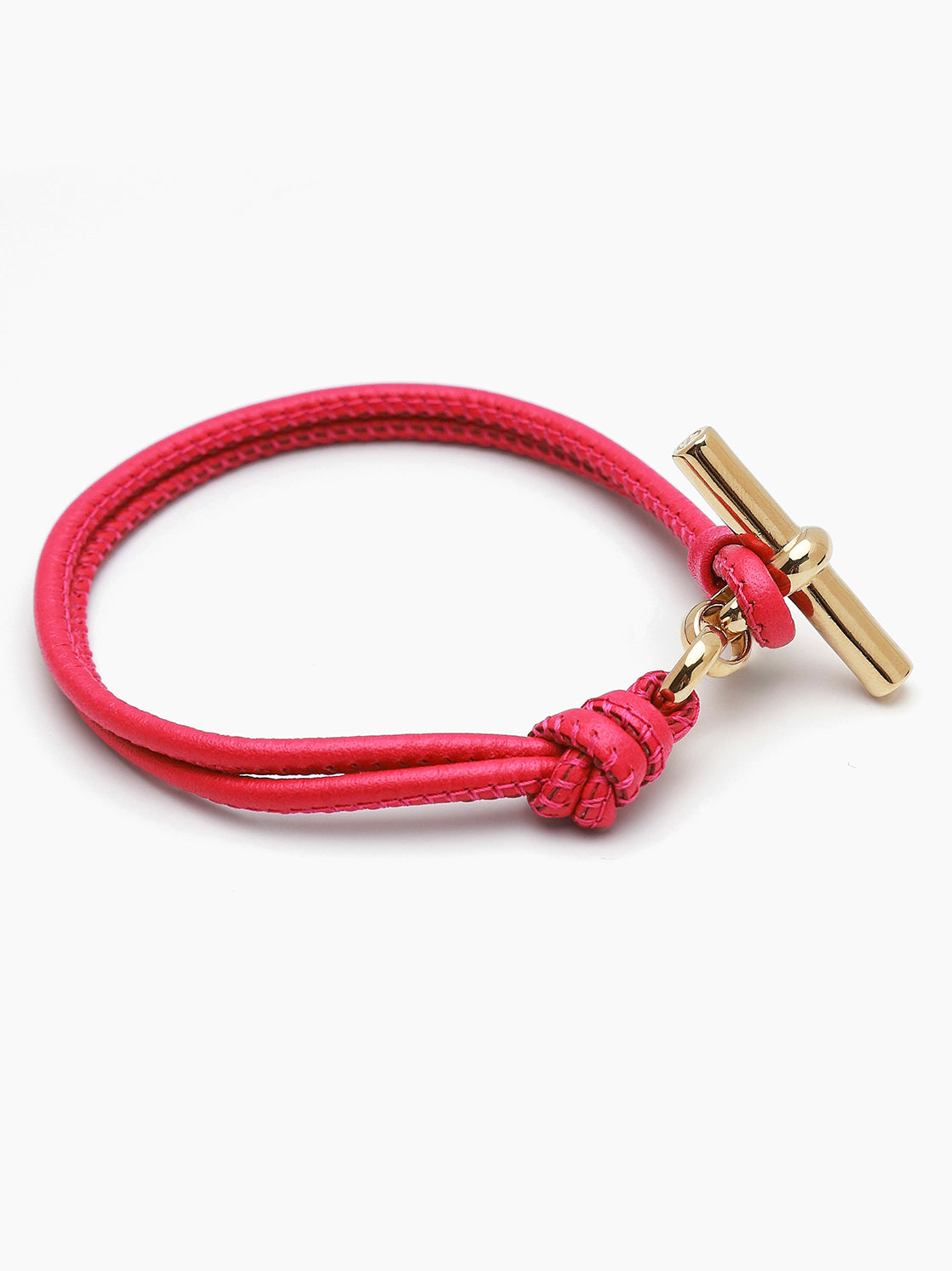 Pink leather bracelet with gold T-bar charm and braided strap