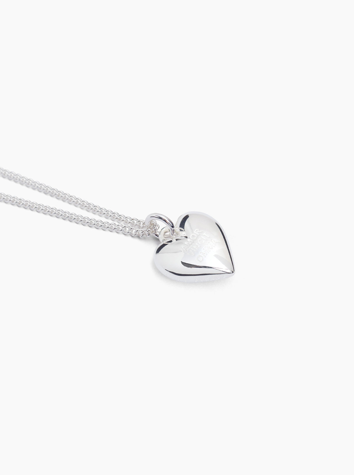 Silver heart charm necklace on fine curb chain, polished heart pendant
