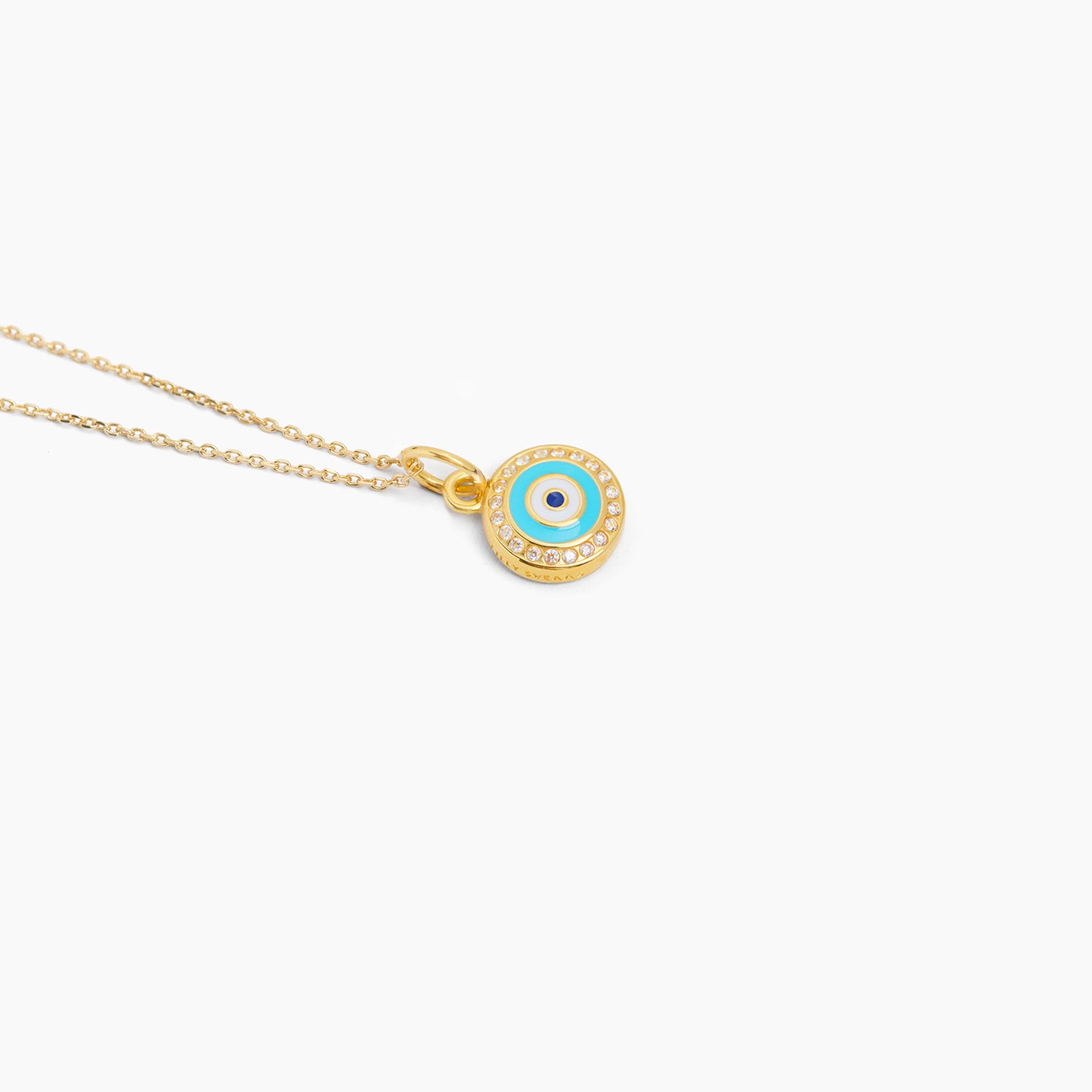 Gold tone evil eye disc necklace with blue enamel center on thin trace chain