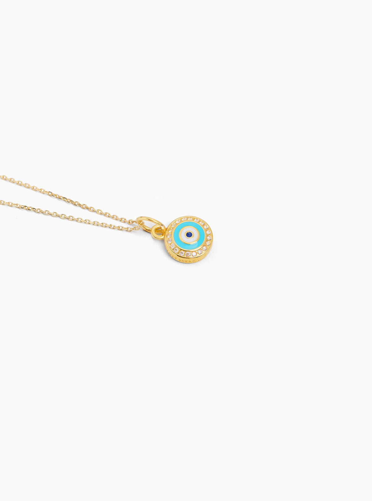 Gold tone evil eye disc necklace with blue enamel center on thin trace chain