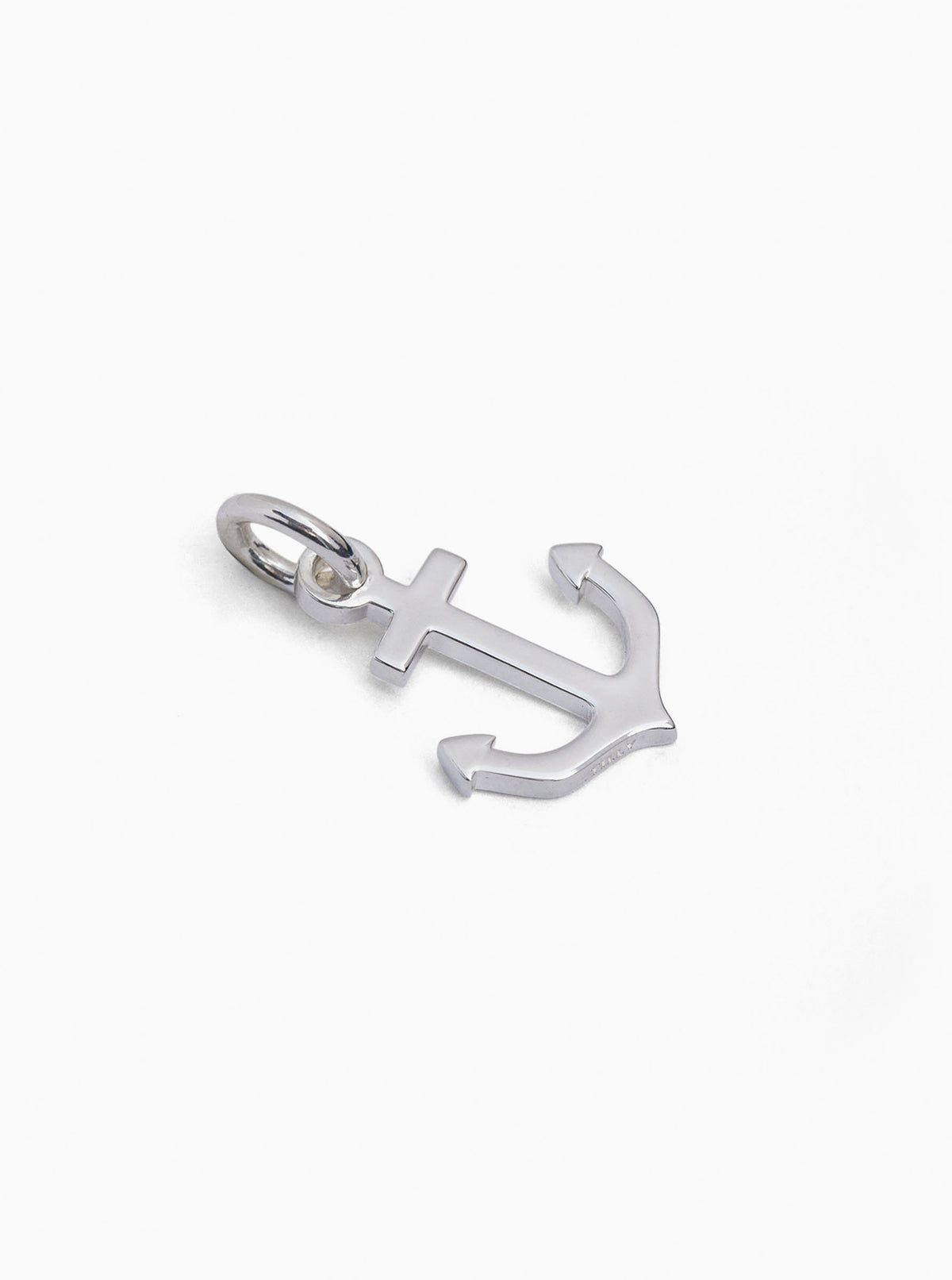 Small silver anchor charm with loop bail, polished metal pendant