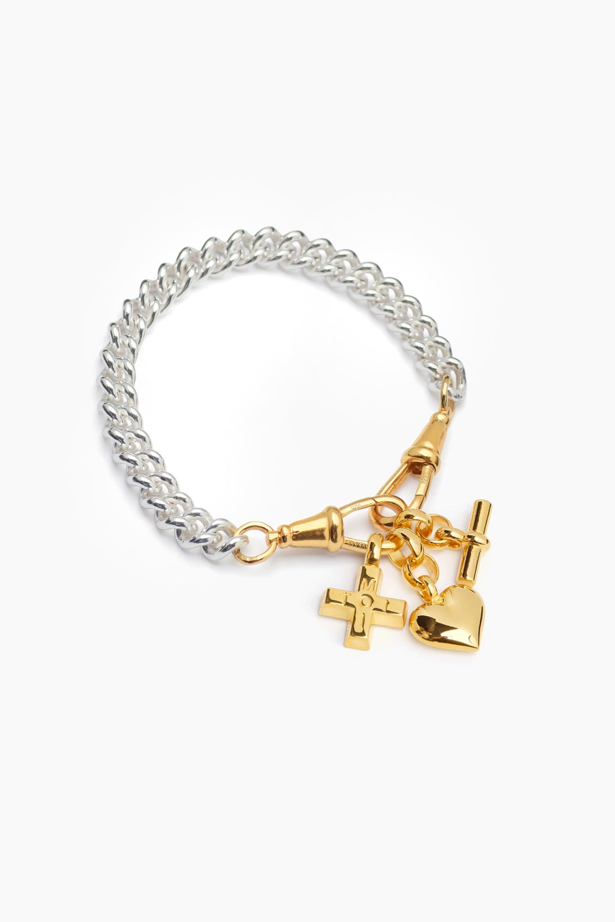 Silver charm bracelet with gold heart, lock, and cross charms