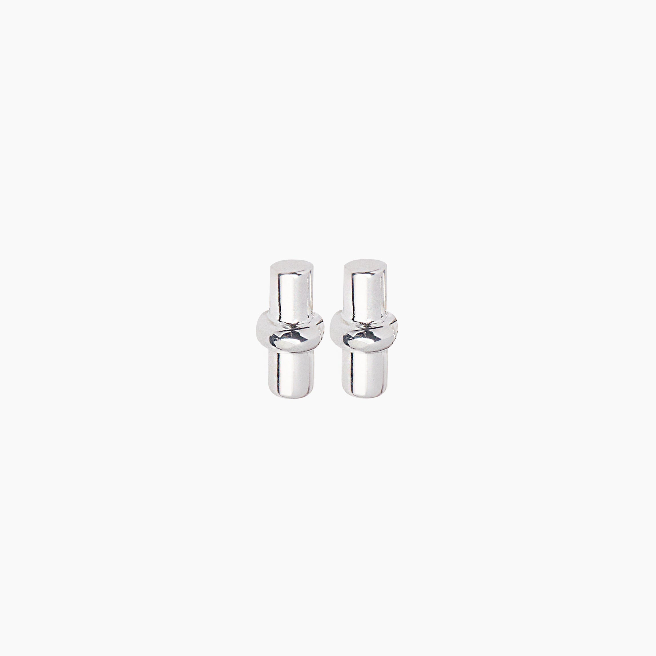 Close-up of silver T-bar stud earrings with polished posts and bars