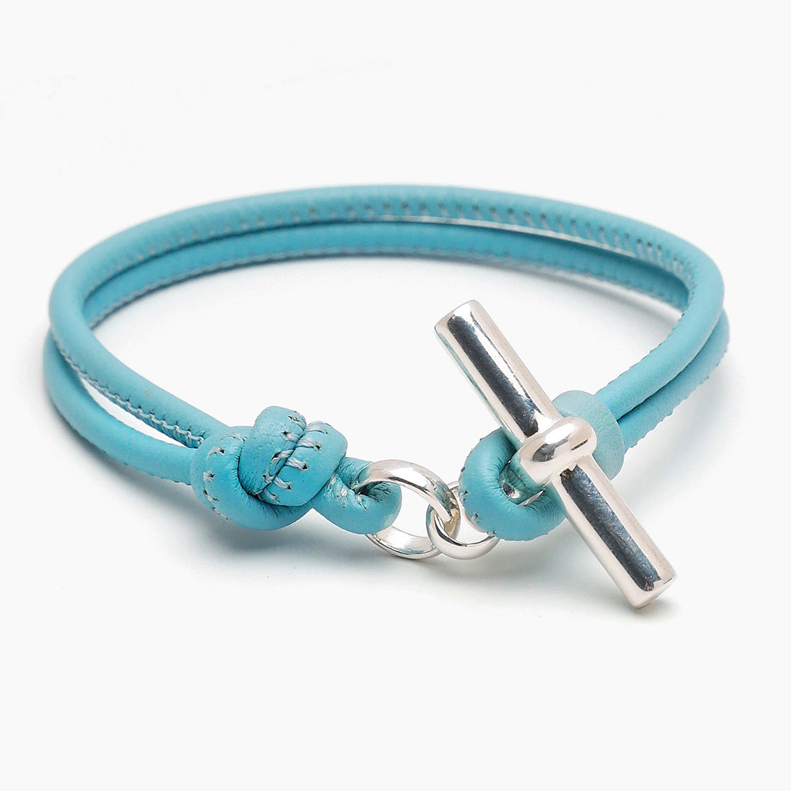 Turquoise leather bracelet with silver T-bar clasp and small bow accent
