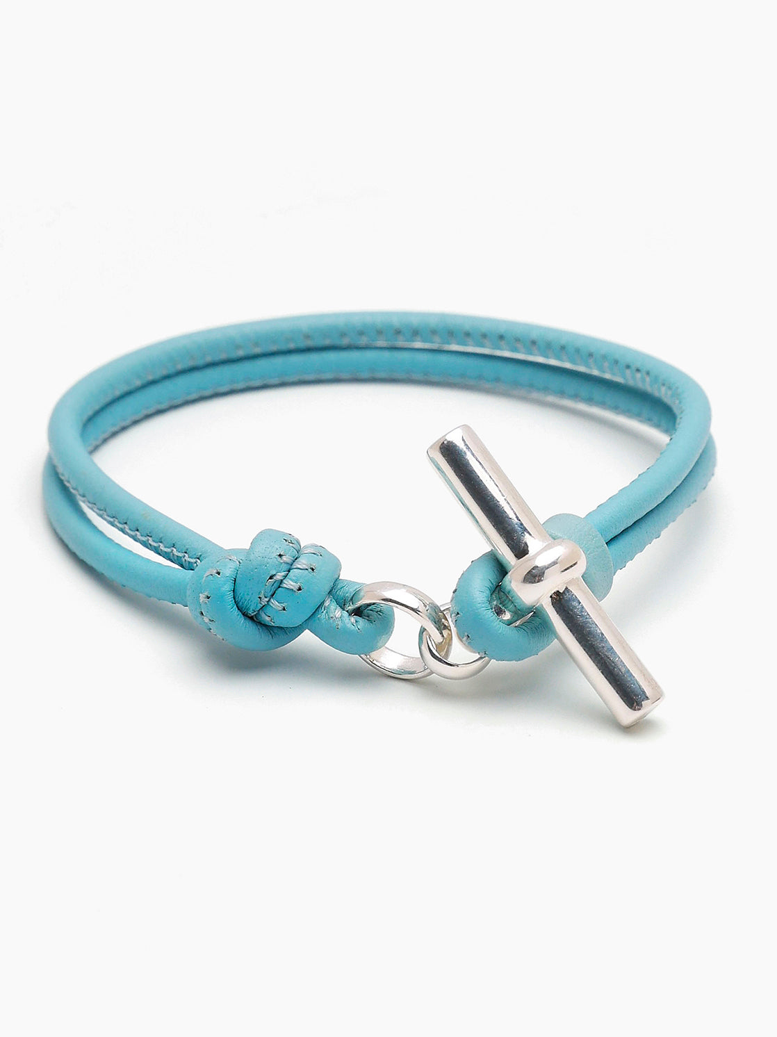 Turquoise leather bracelet with silver T-bar clasp and small bow accent