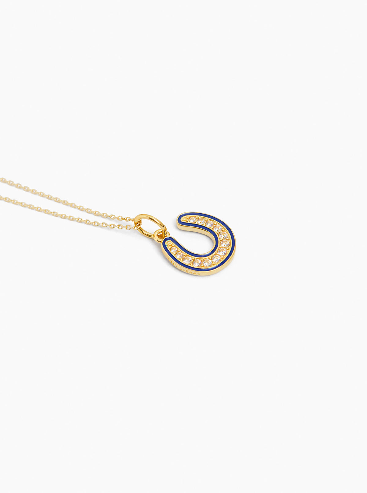 Gold horseshoe pendant necklace with blue jeweled trim on trace chain