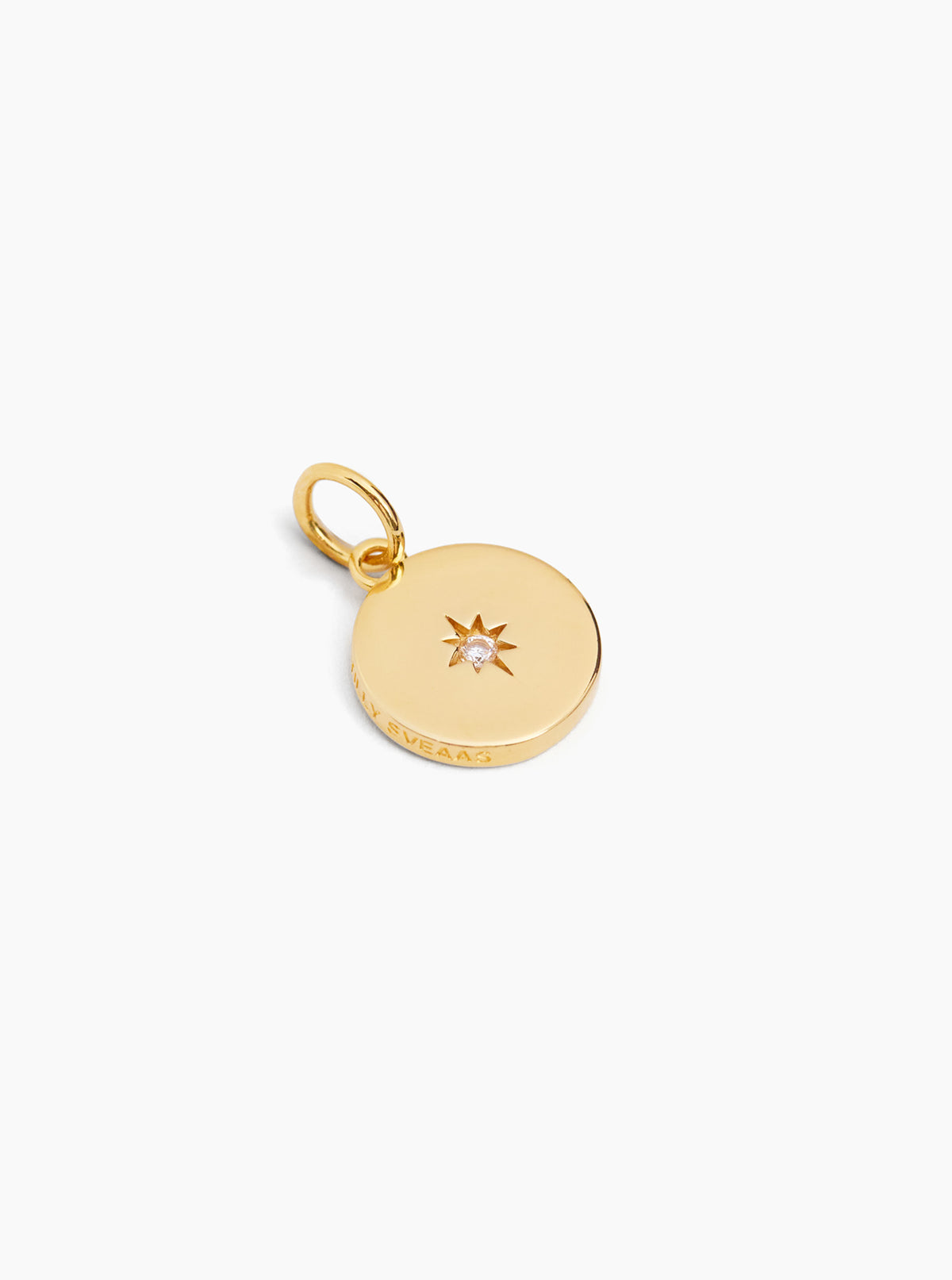 Gold disc charm with starburst jewel and attached jump ring, engraved front.