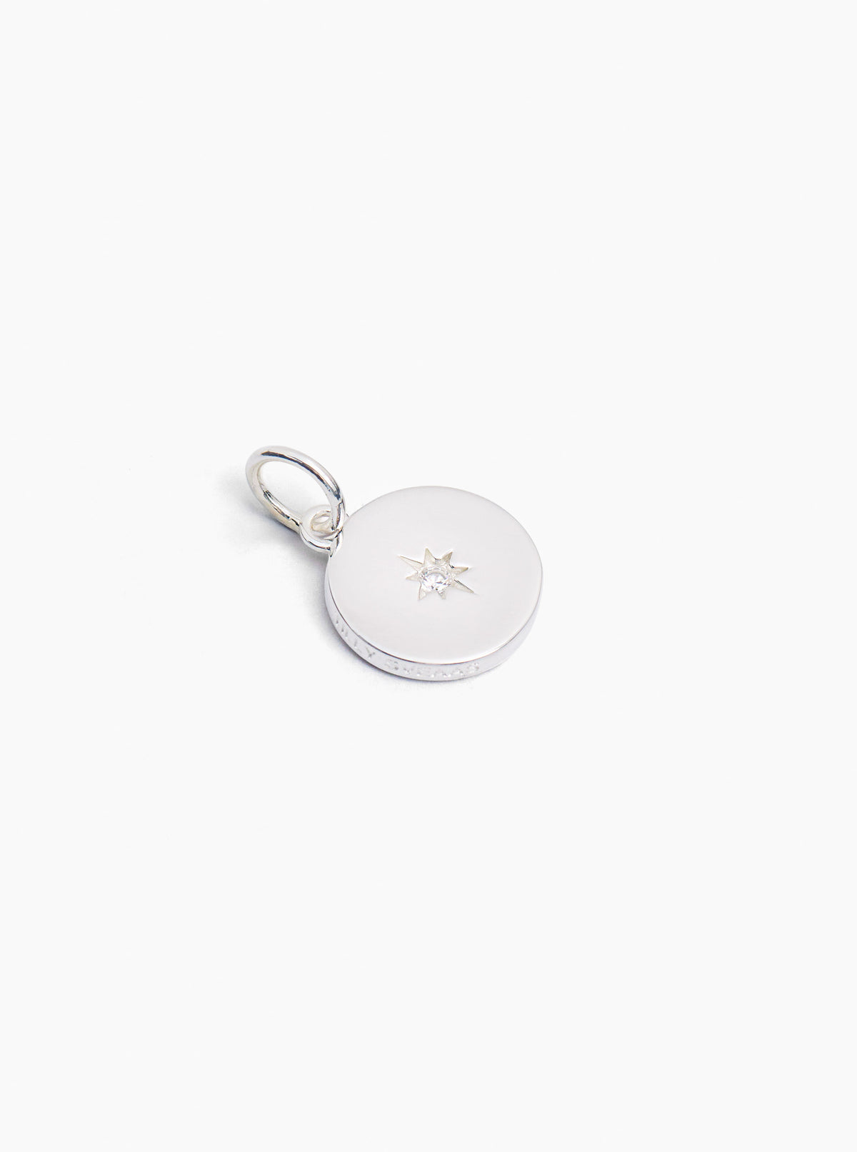 Silver disc charm with small star jewel and attached split ring clasp
