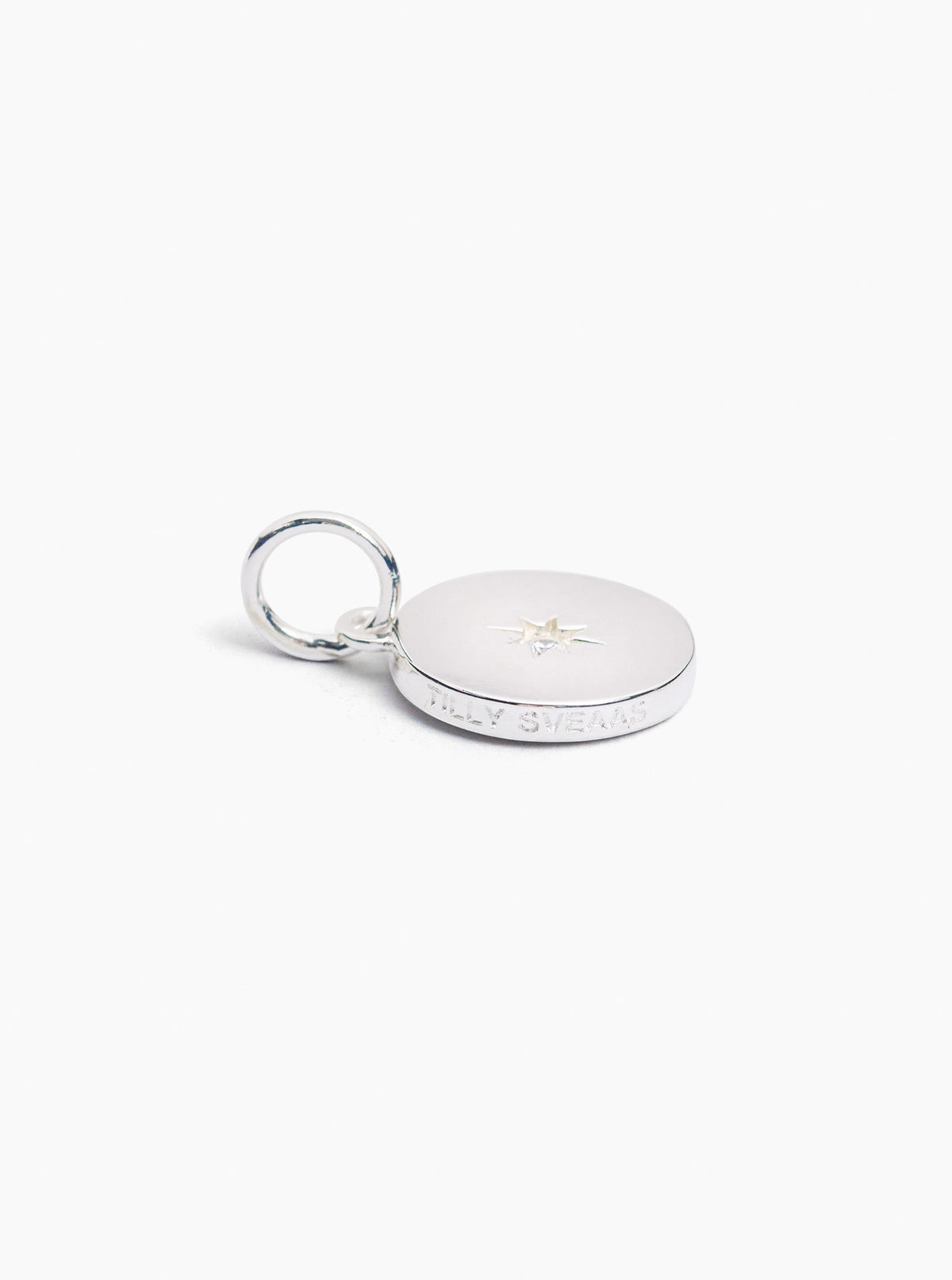 Silver disc charm with star jewel and textured edge with split ring clasp