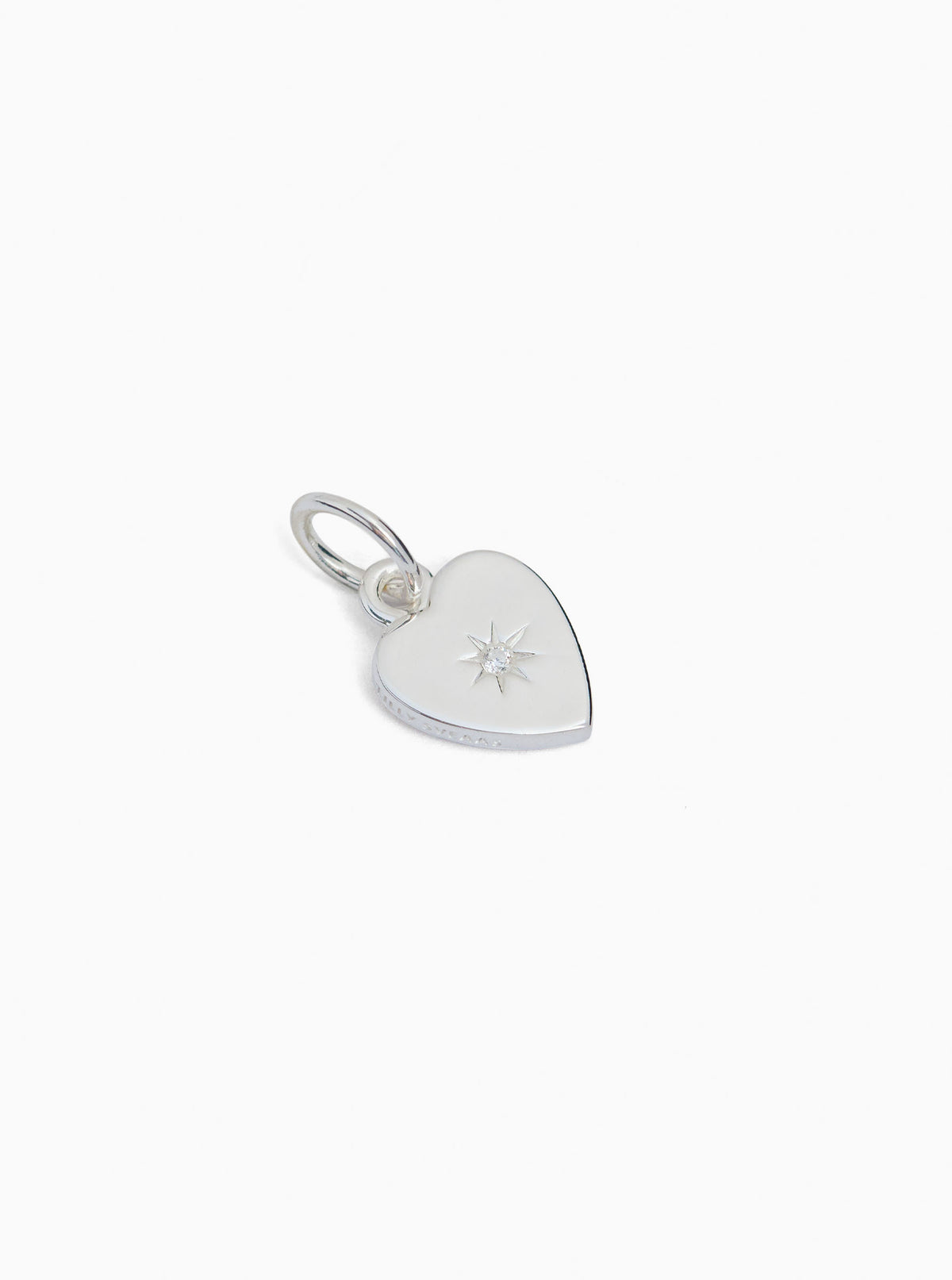 Small silver heart charm with jeweled star detail and loop clasp