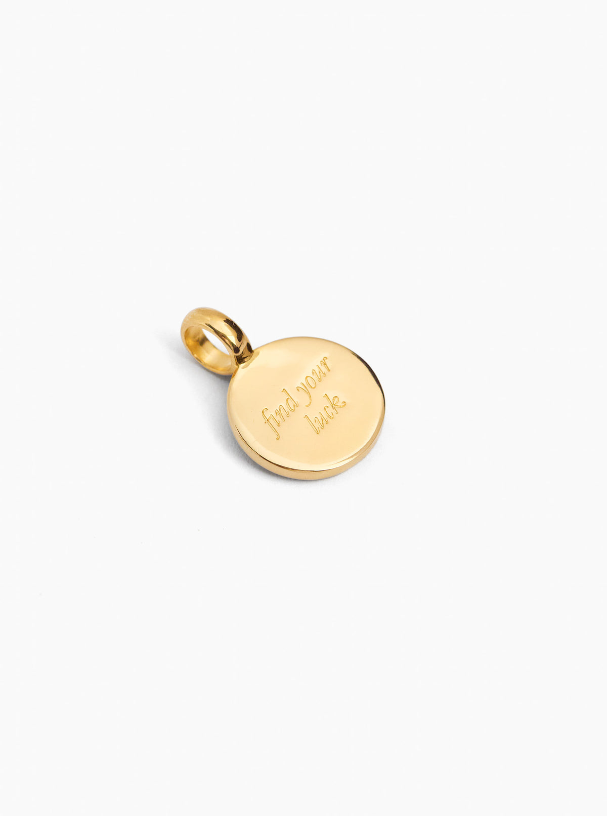 Small gold round charm with engraved text and top loop bail