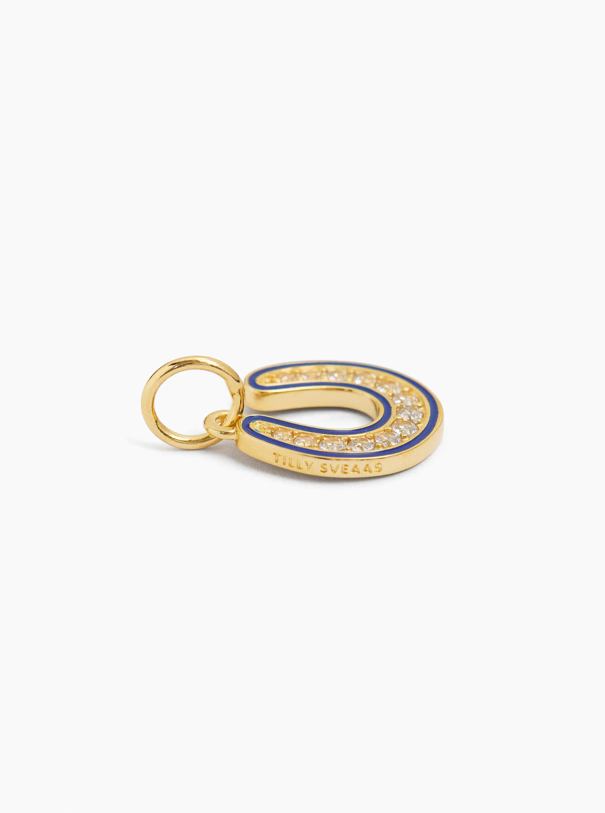 Gold horseshoe charm with blue enamel and sparkling stones, with small hanging loop