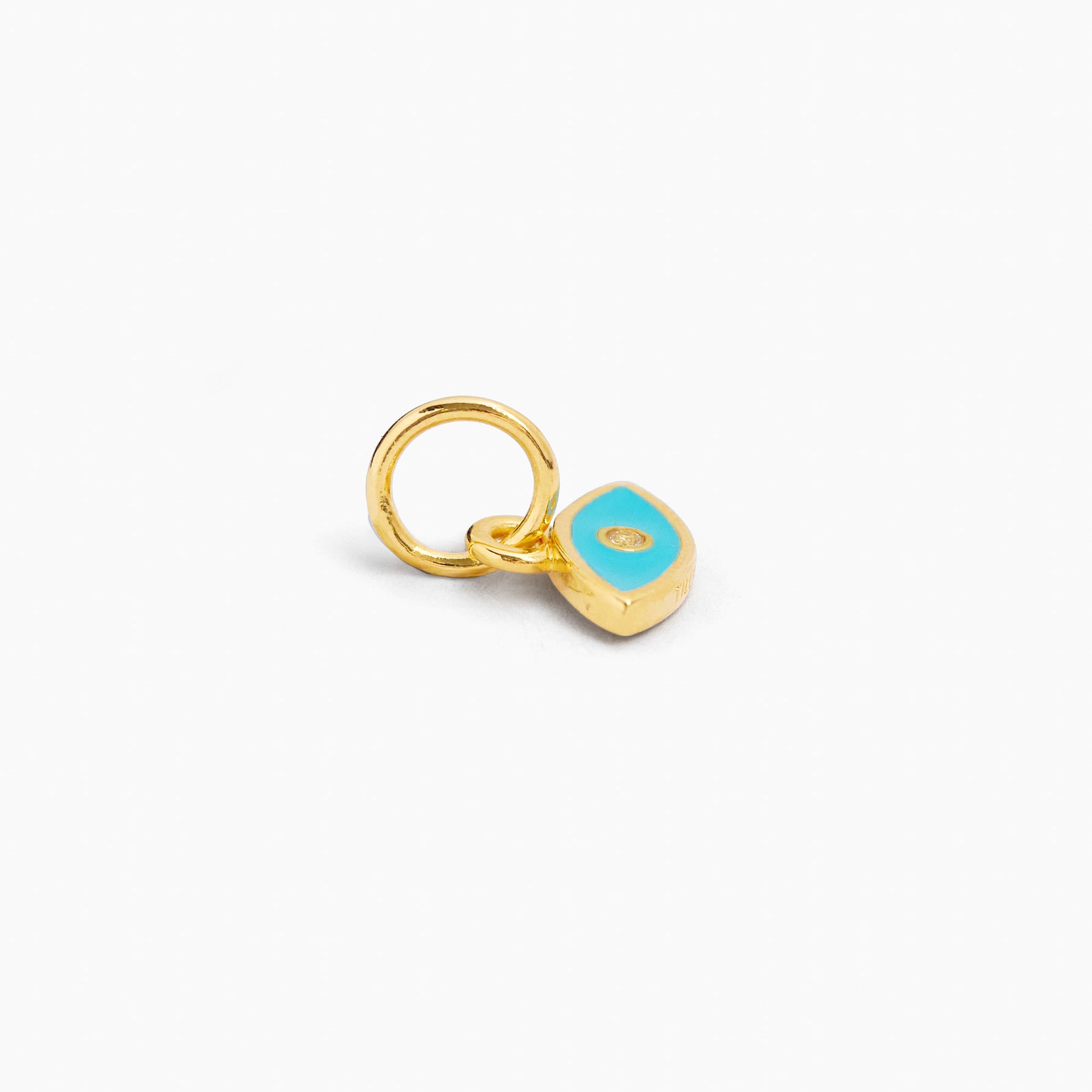 Gold evil eye charm with turquoise teardrop pendant and small eye detail, with ring loop
