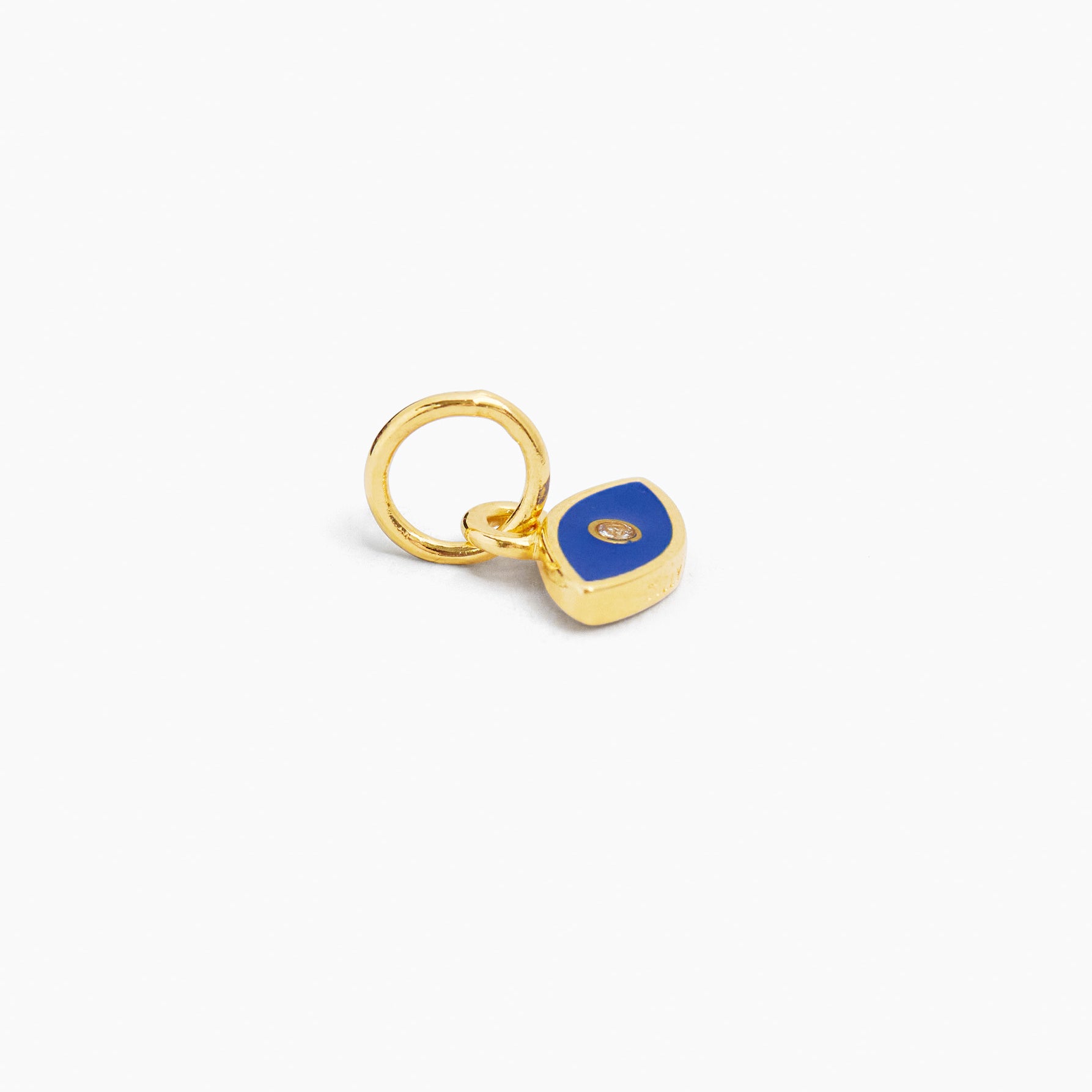 Gold-tone evil eye charm with navy-blue enamel teardrop pendant and loop bail