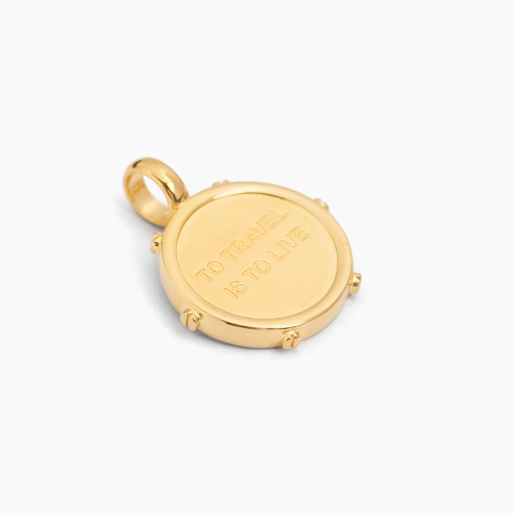 Gold-tone compass charm with cream enamel center and engraved border, loop bail