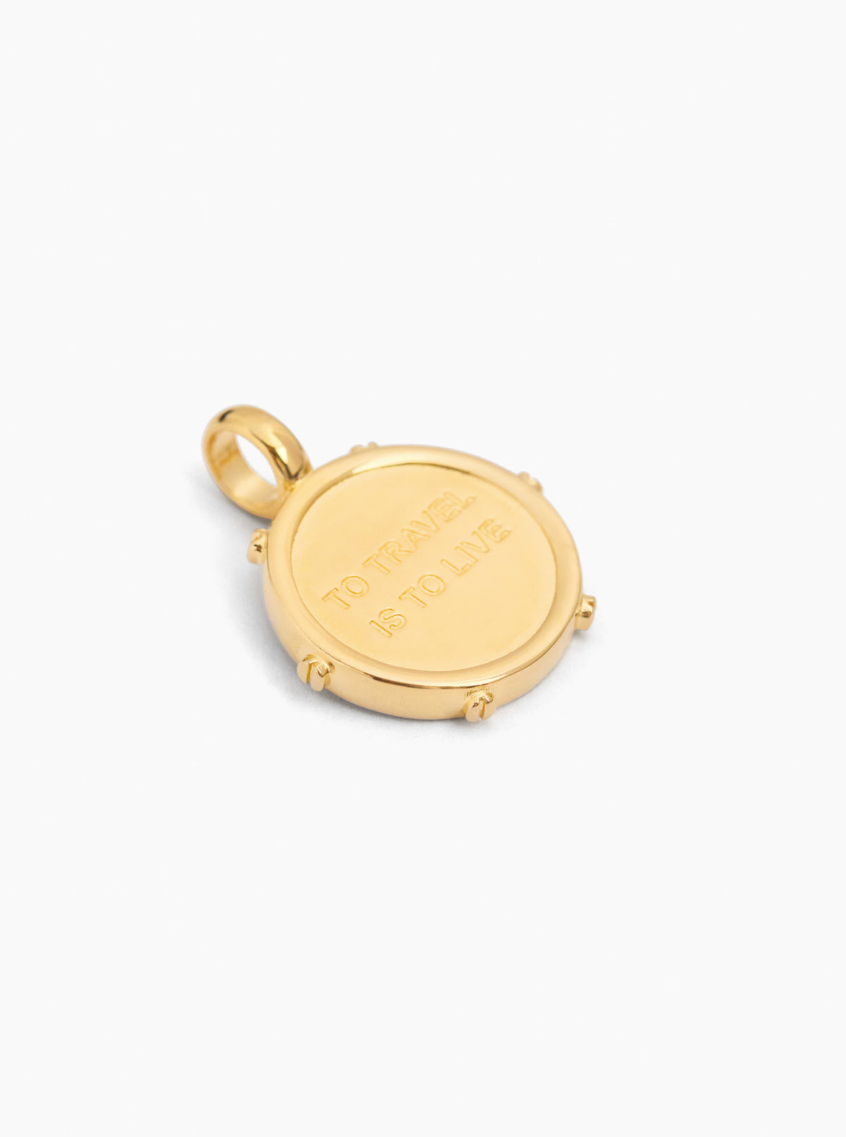 Gold-tone compass charm with cream enamel center and engraved border, loop bail