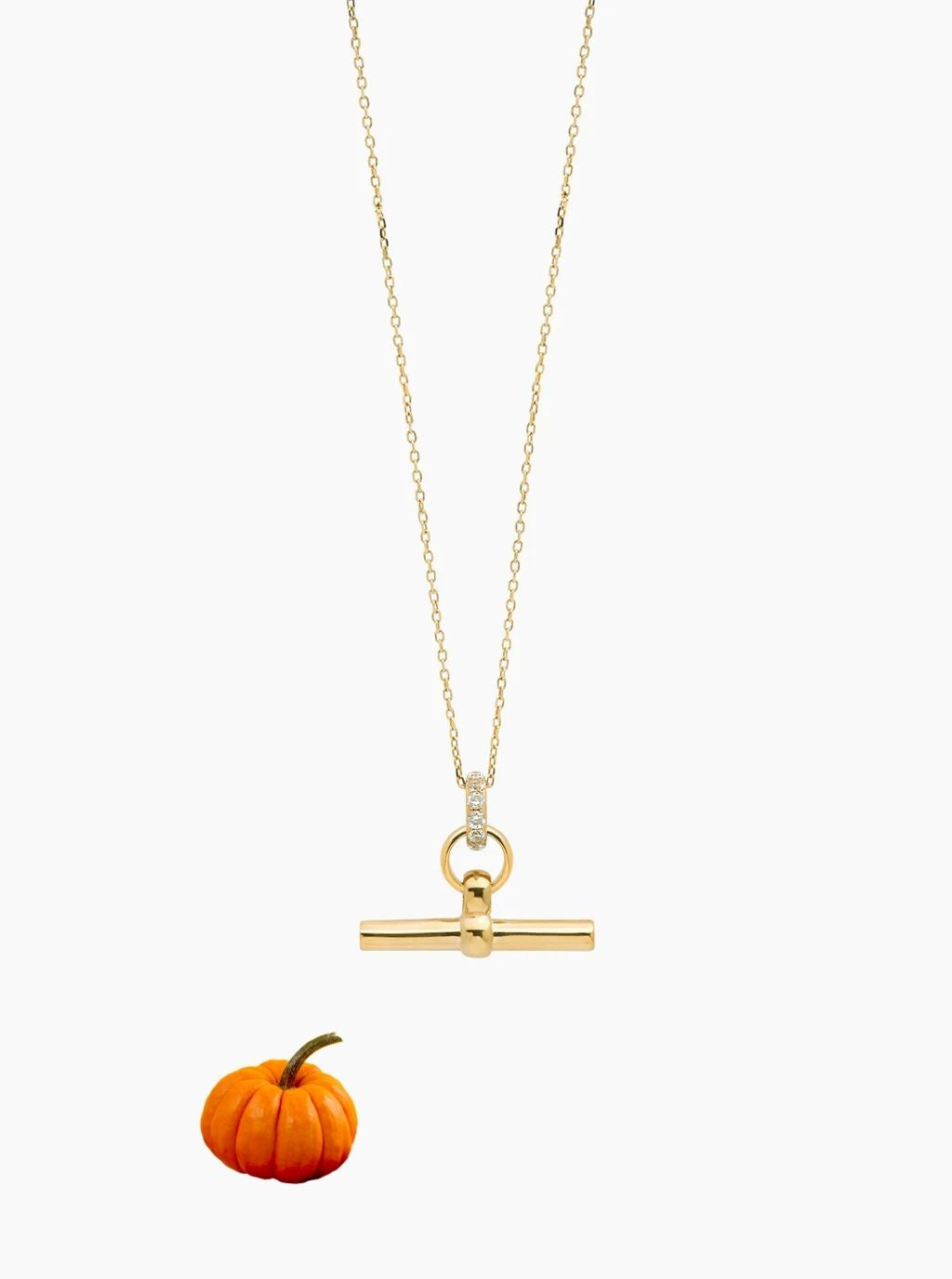 Gold T-bar pendant necklace with a fine trace chain and small clear stones