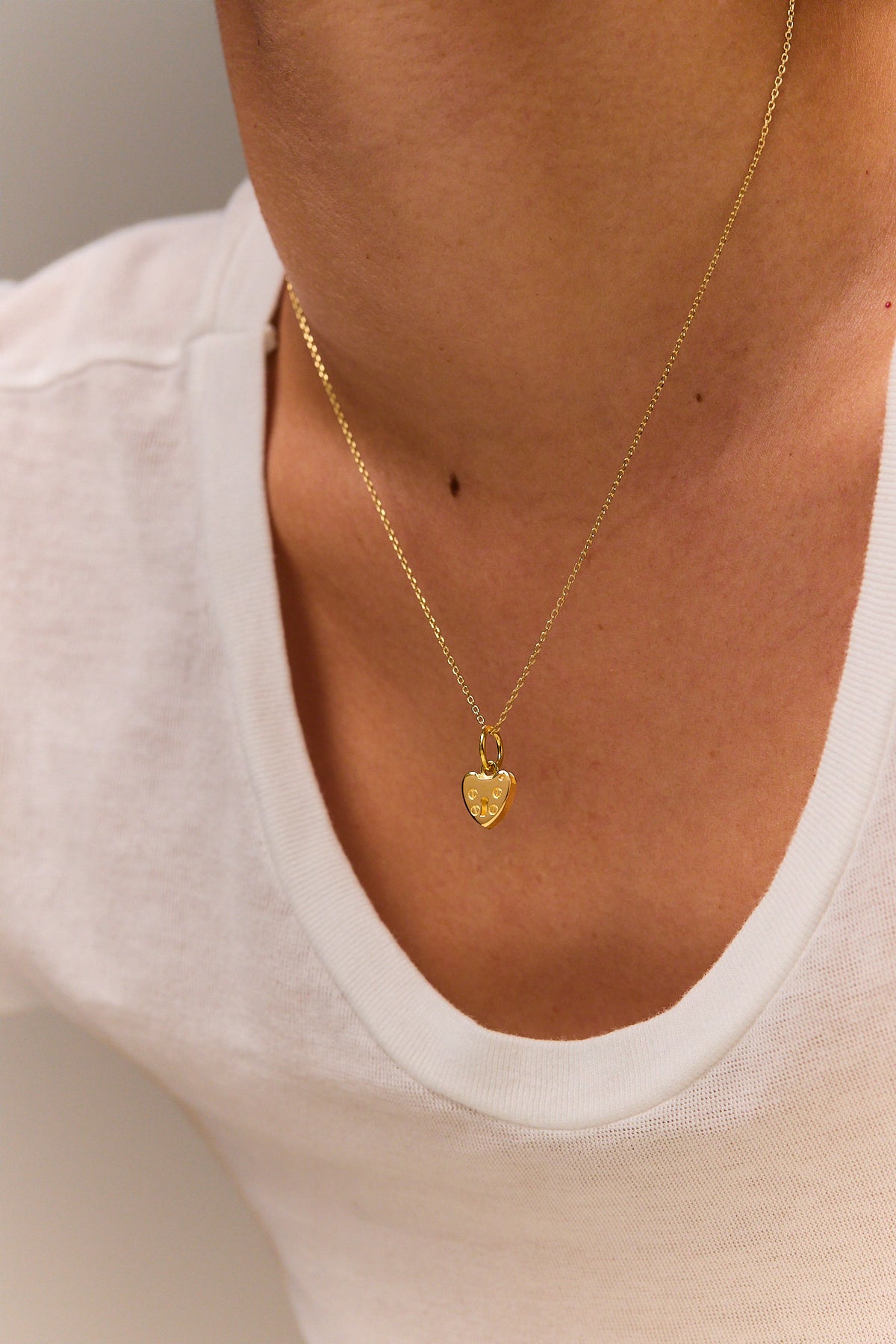 Gold heart padlock charm necklace with fine trace chain