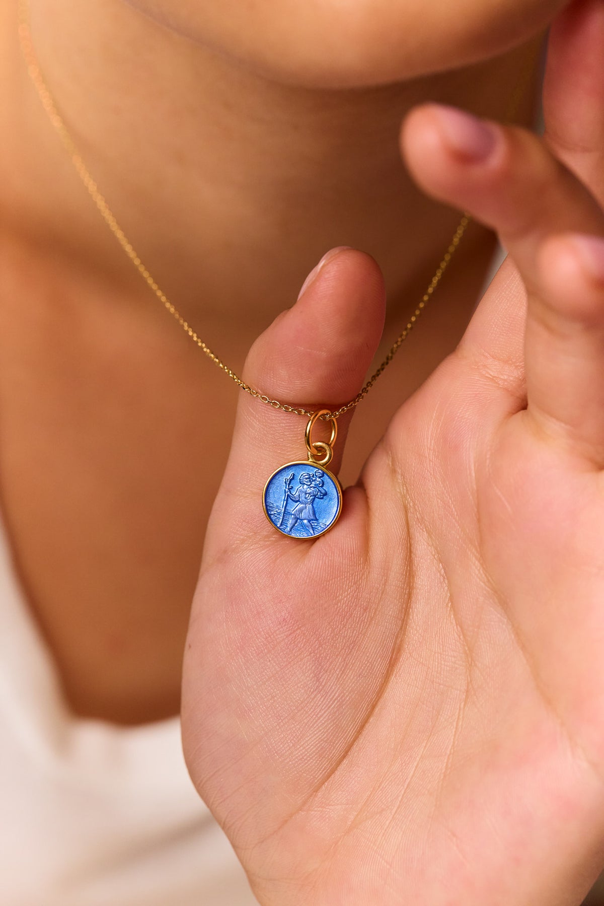 Gold trace chain necklace with blue St Christopher medallion pendant