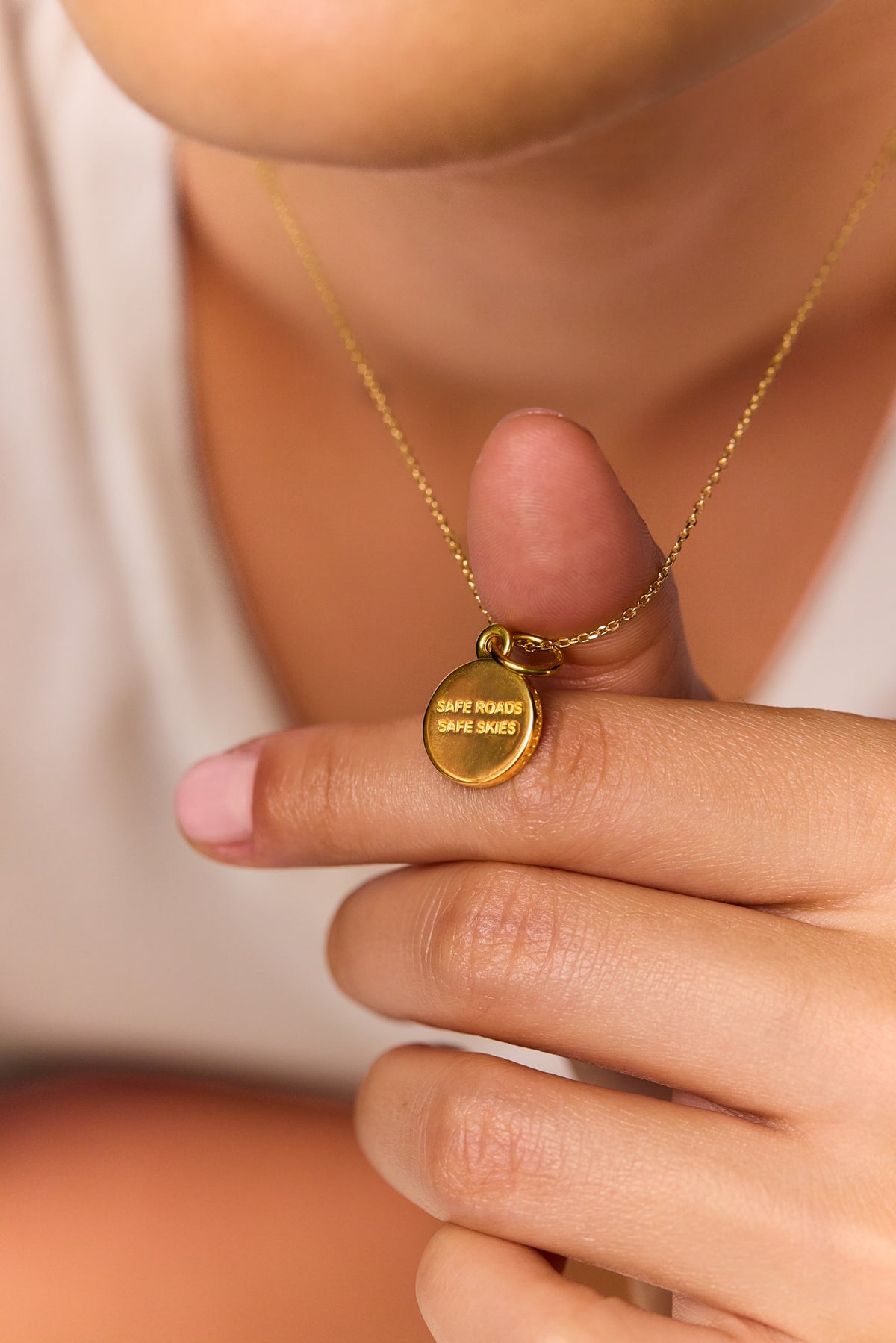 St Christopher medallion pendant with engraved back on gold trace chain