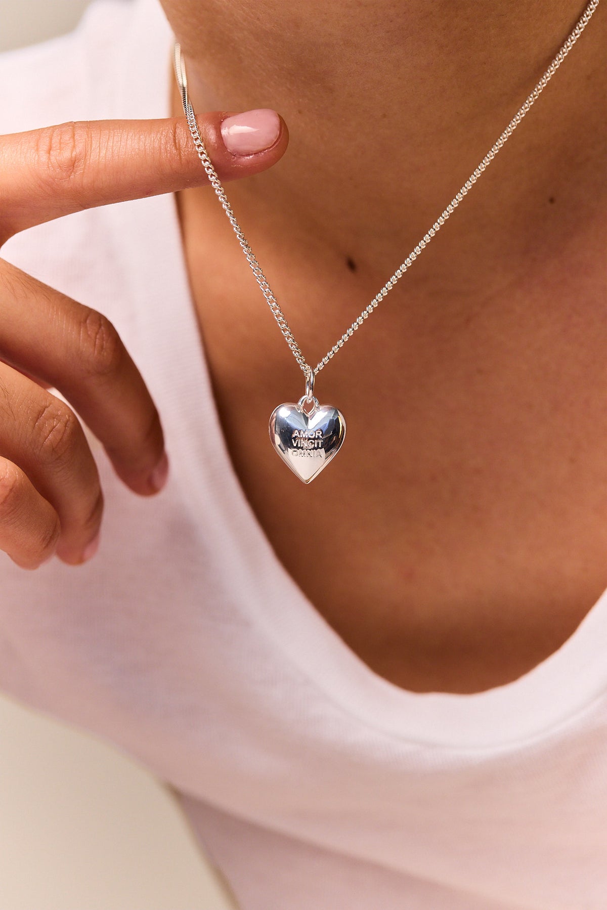 Silver heart pendant necklace on fine curb chain, blue enamel heart detail