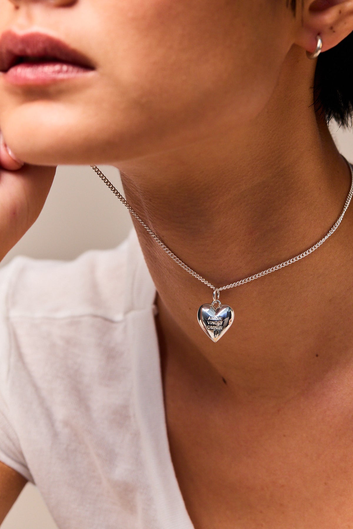 Silver heart pendant necklace on fine curb chain with blue enamel heart charm