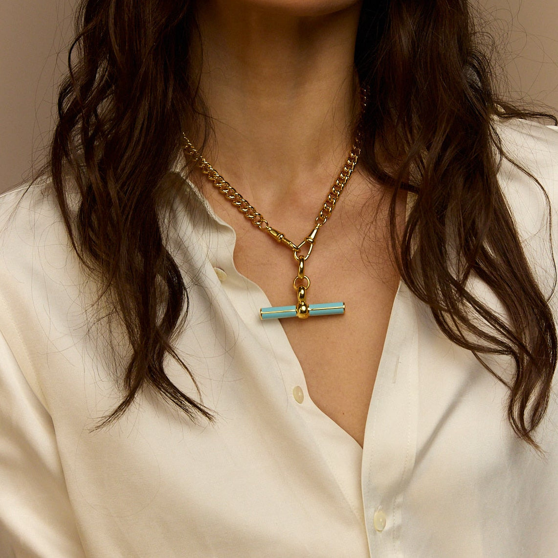 Gold curb-link necklace with blue enamel T-bar charm
