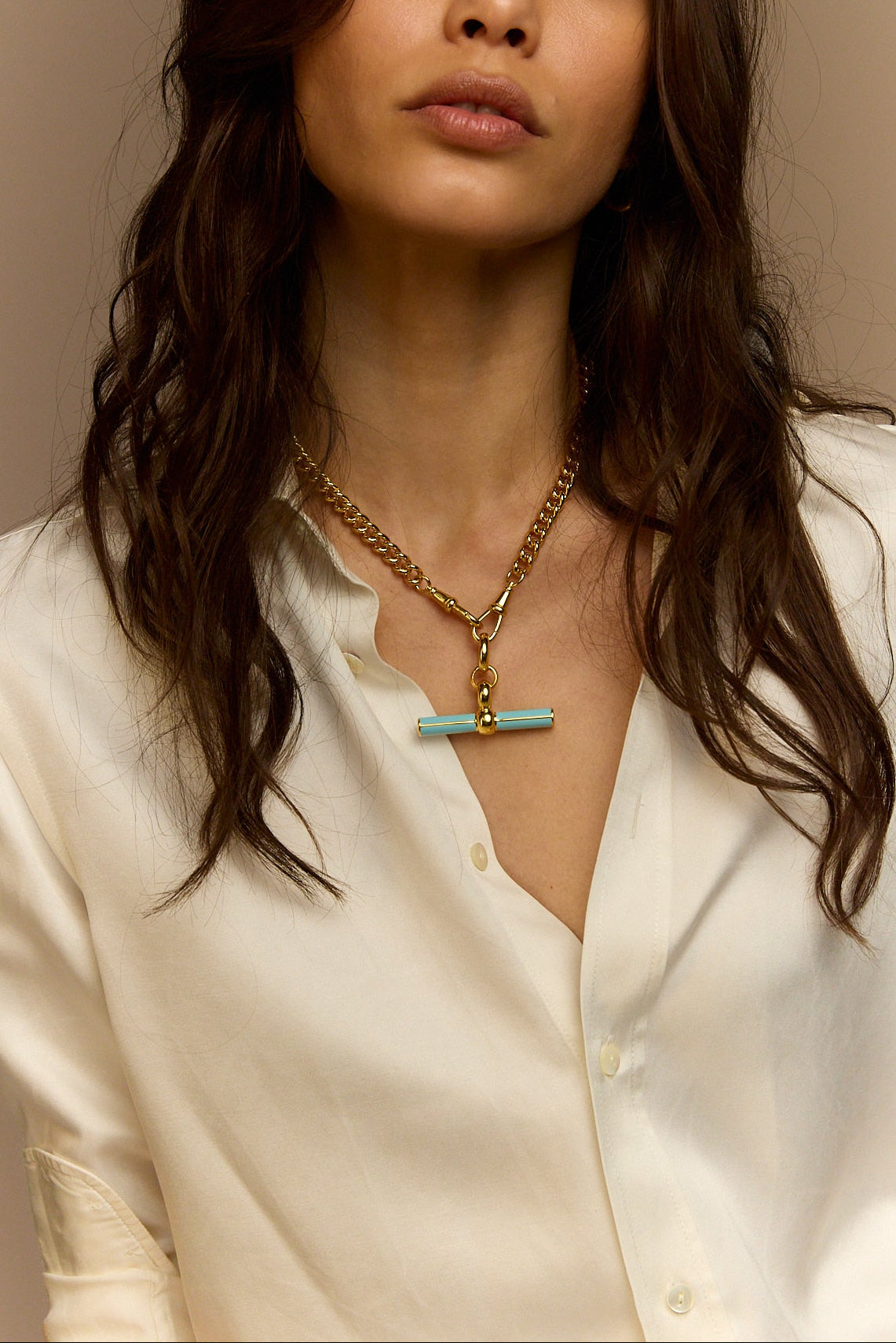 Gold curb-link necklace with blue enamel T-bar charm