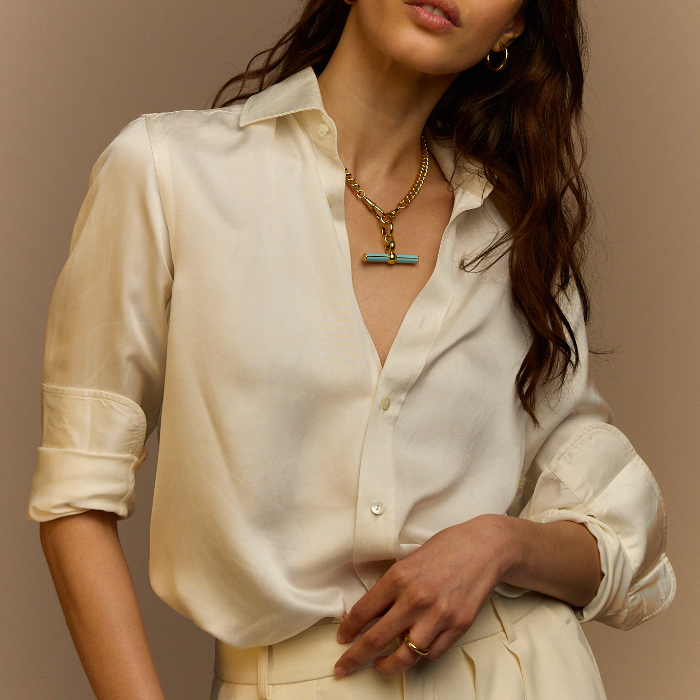 Gold curb-link necklace with blue enamel T-bar pendant