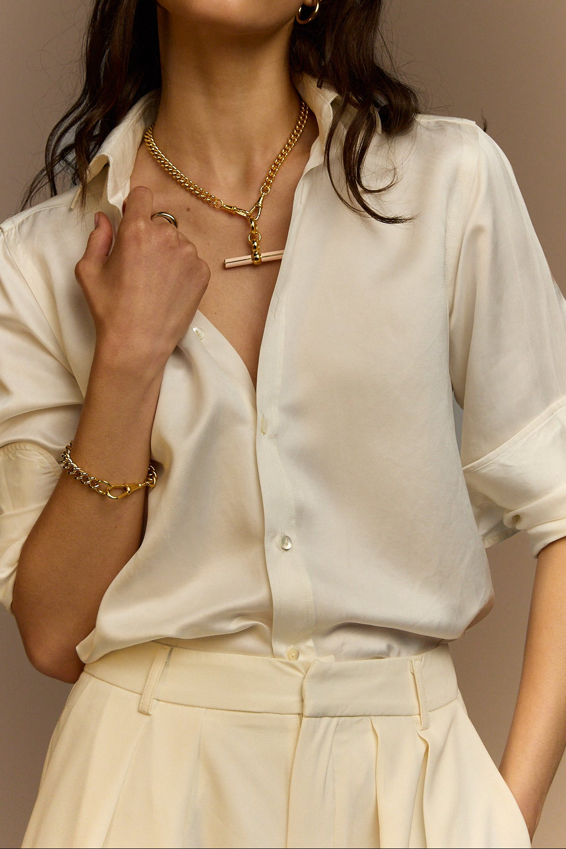 Gold necklace with curb chain and cream enamel T-bar pendant