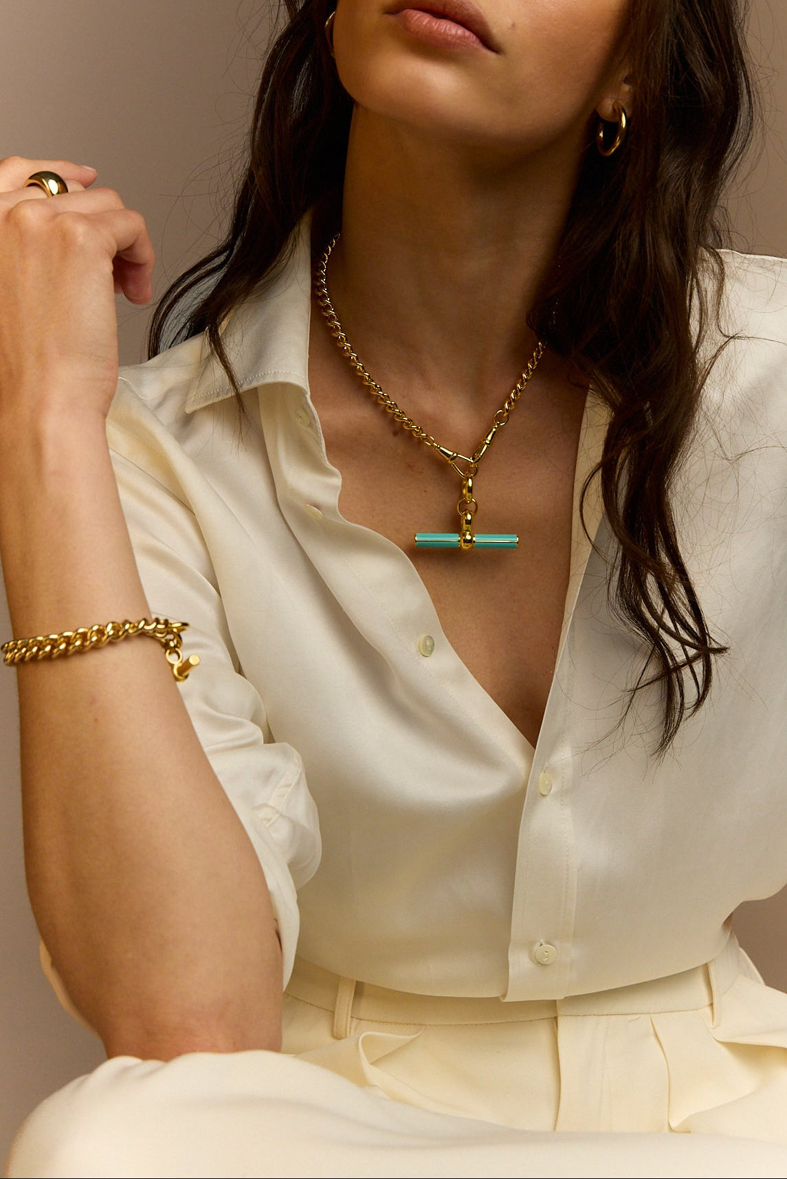 Gold chain necklace with mint enamel T-bar pendant, shown on collarbone