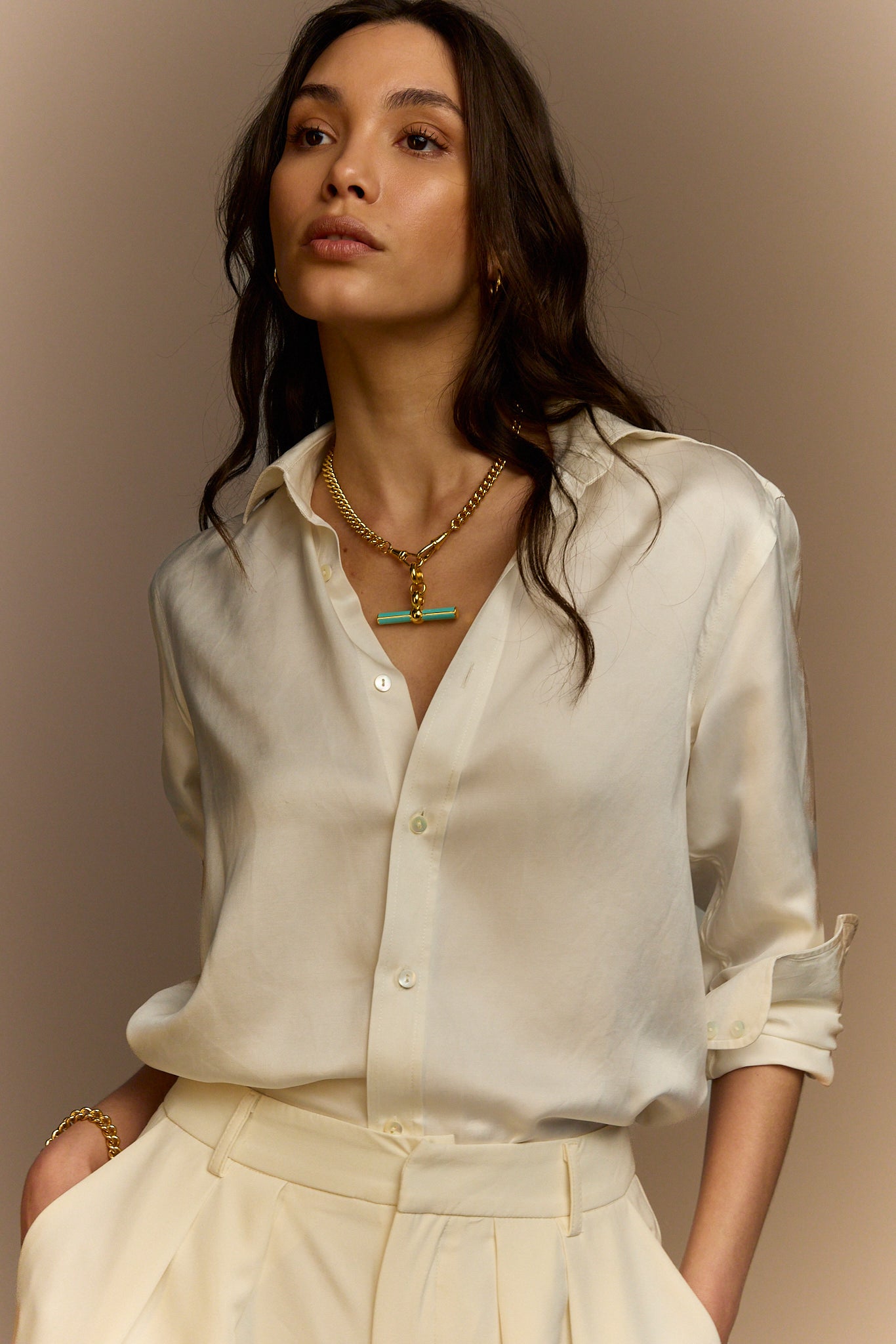 Gold chain necklace with mint enamel T-bar pendant, centered on neckline