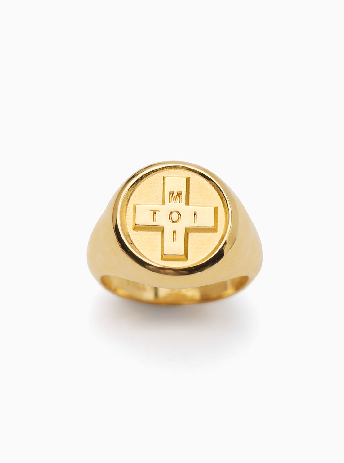 Gold ring with a cross design on a white background