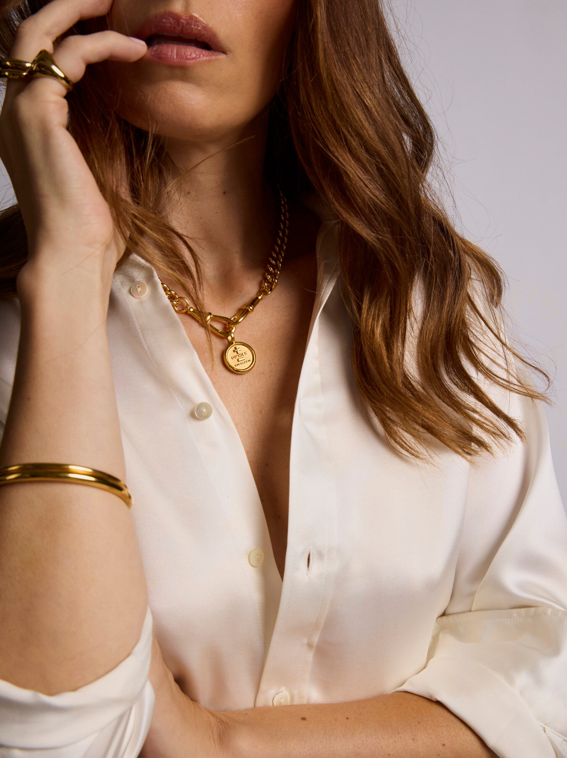 Large Gold Que Demain Disc on Large Curb Clipt Necklace