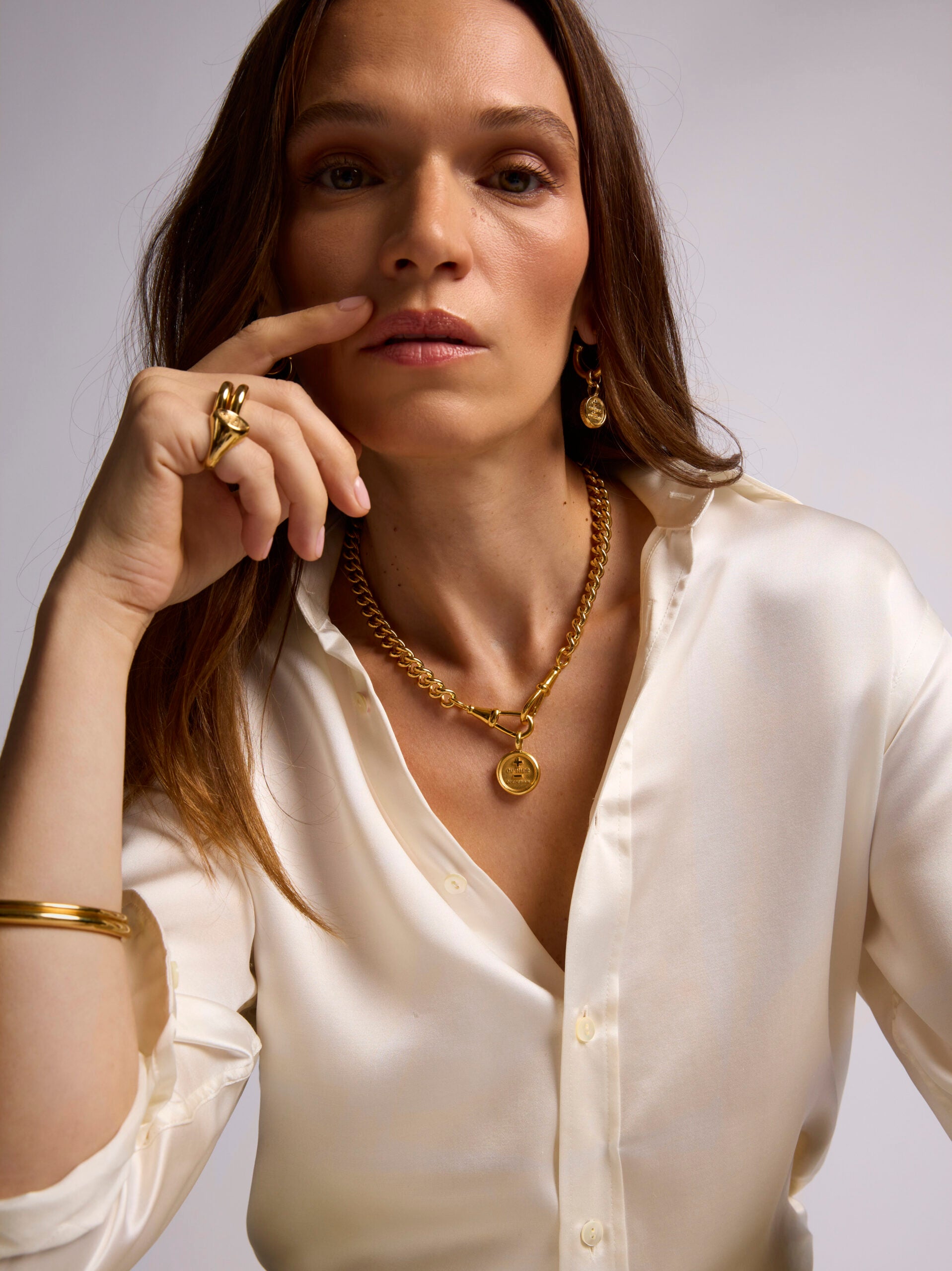 Large Gold Que Demain Disc on Large Curb Clipt Necklace
