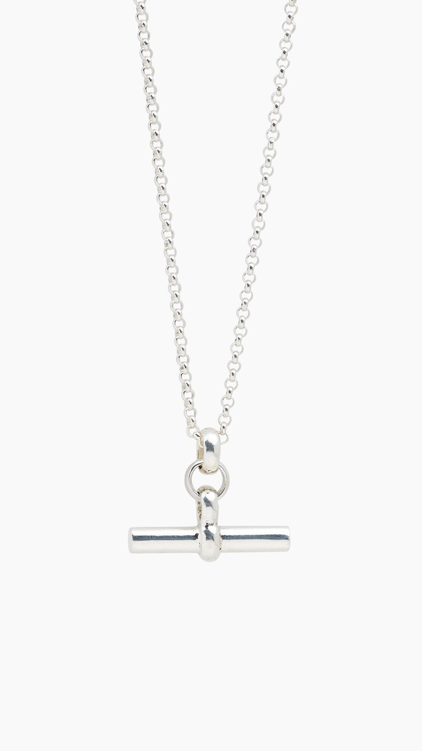 Silver necklace with a bar pendant on a white background
