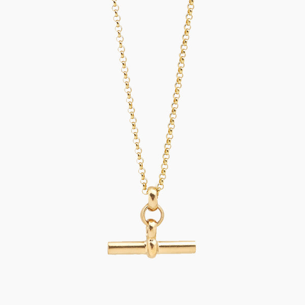 Gold necklace with a bar pendant on a white background - Tilly Sveaas Jewellery 