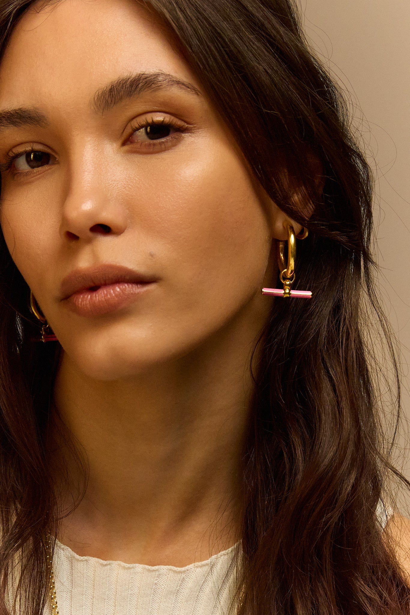Gold hoop earrings with pink enamel bar accent