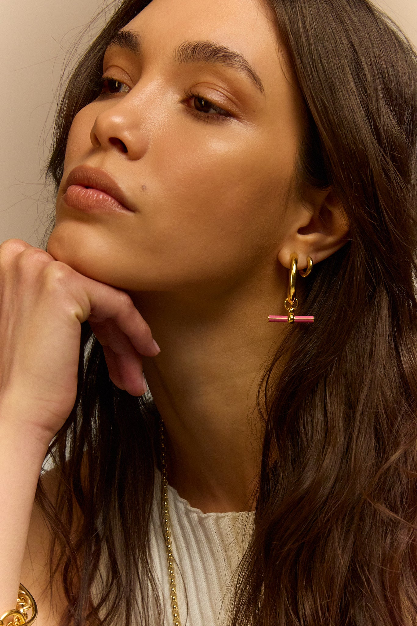 Gold hoop earrings with pink enamel bar and charm