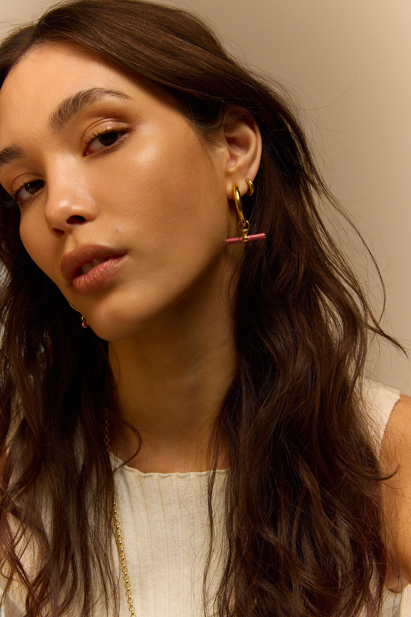 Gold hoop earrings with pink enamel horizontal bar