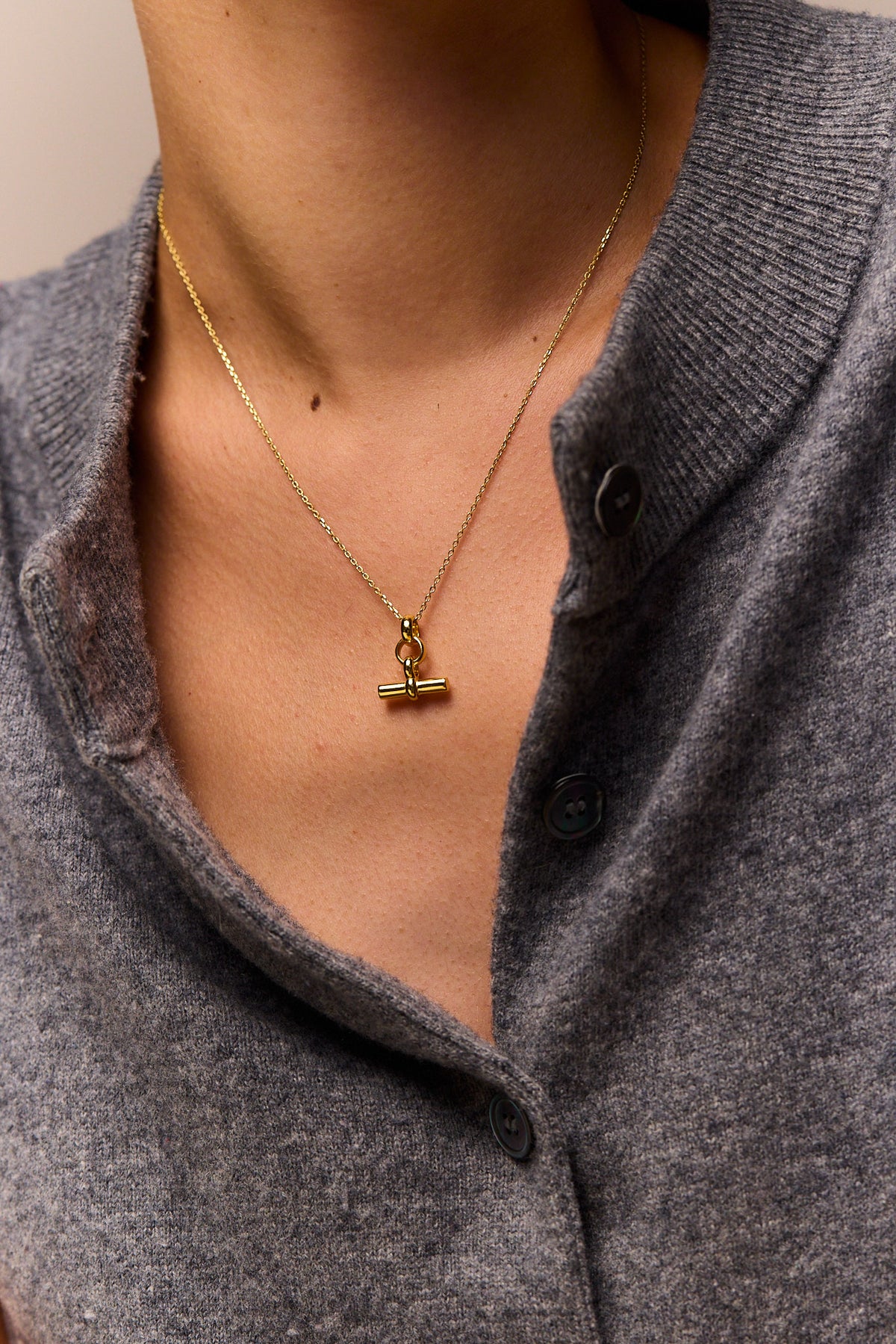 Gold mini T-bar pendant necklace on trace chain with small link chain detail
