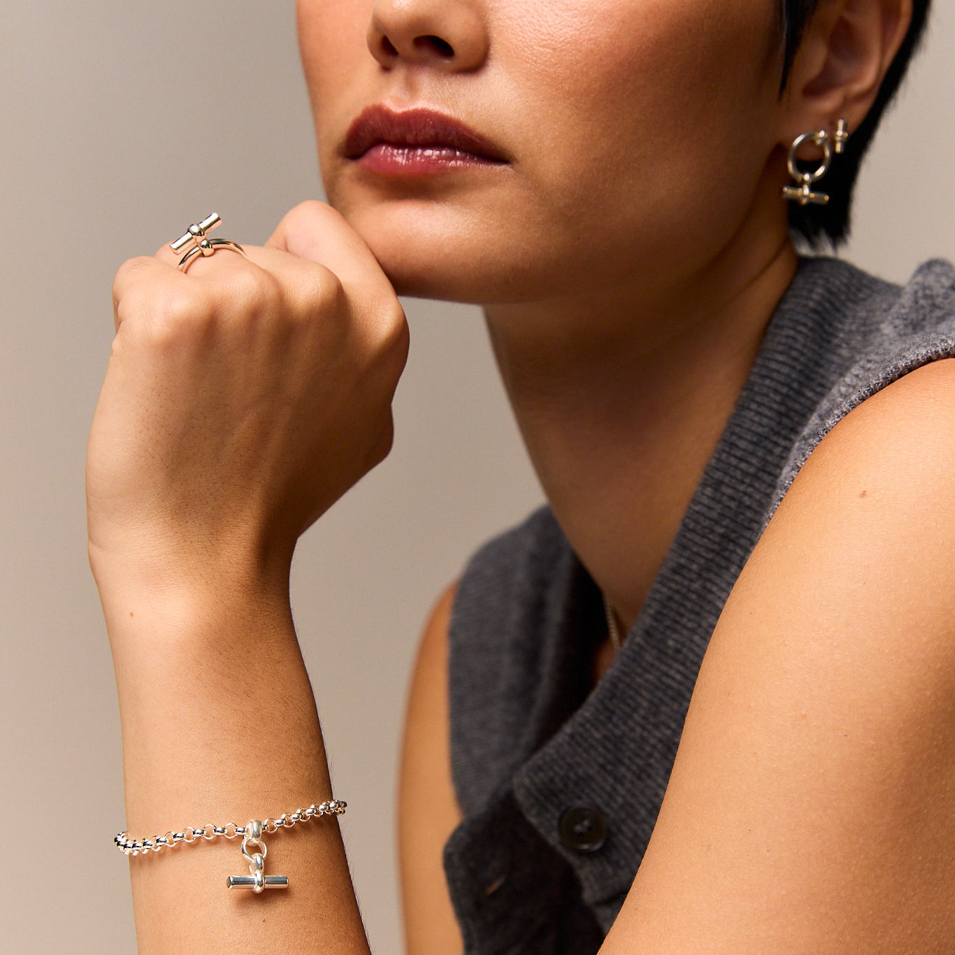 Silver belcher bracelet with mini T-bar charm on wrist