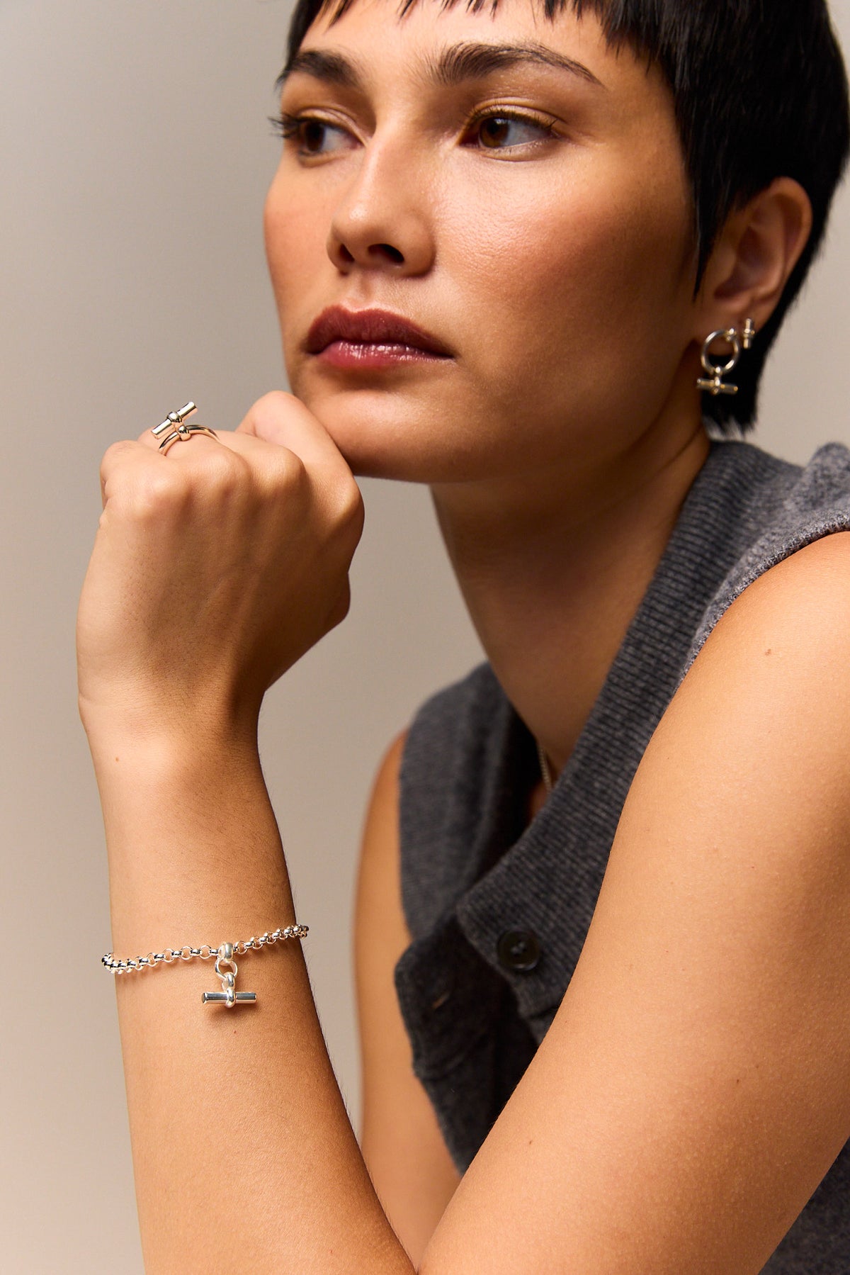 Silver belcher bracelet with mini T-bar charm on wrist